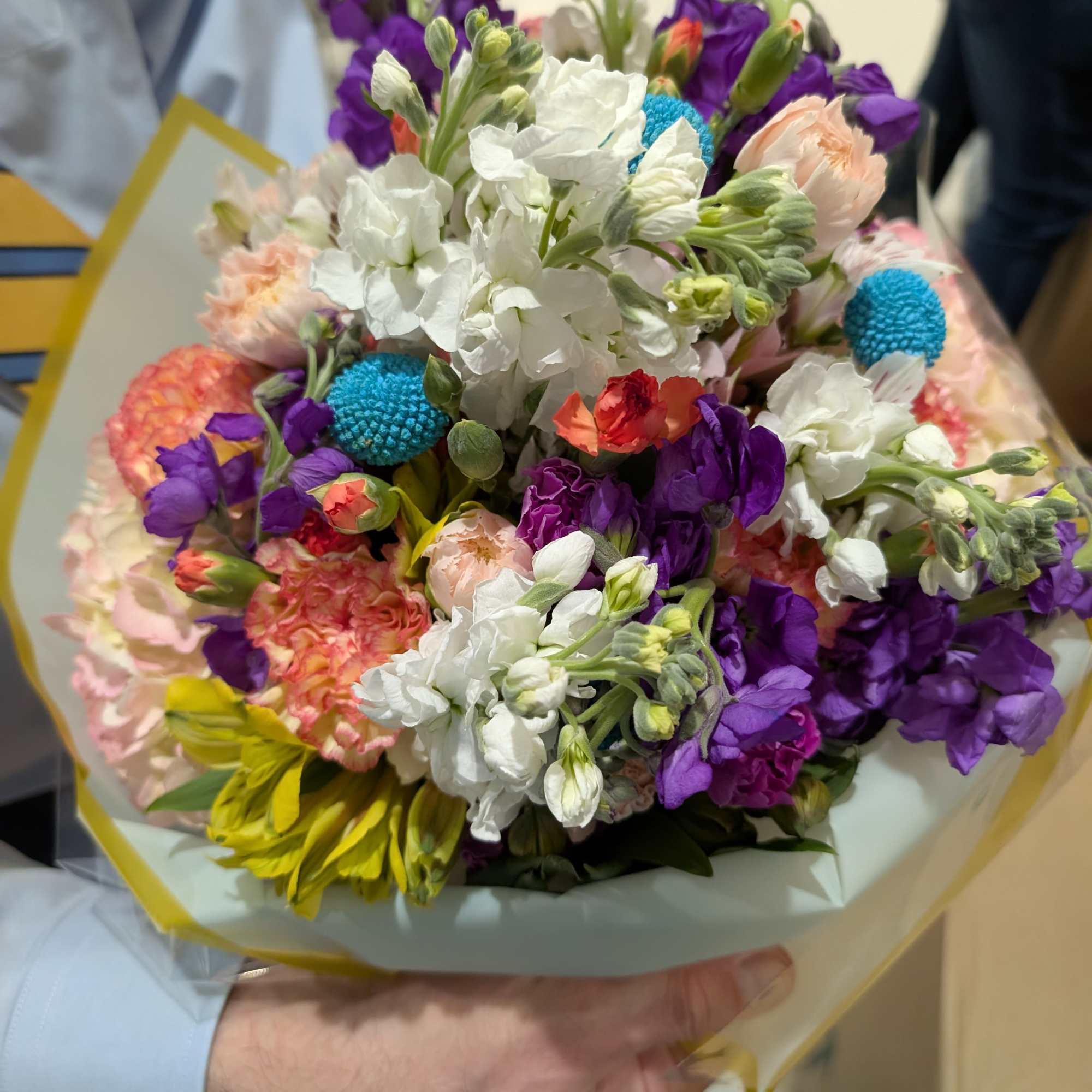 Fresh custom bouquet, tied and wrapped with a bow.  Designers Choice