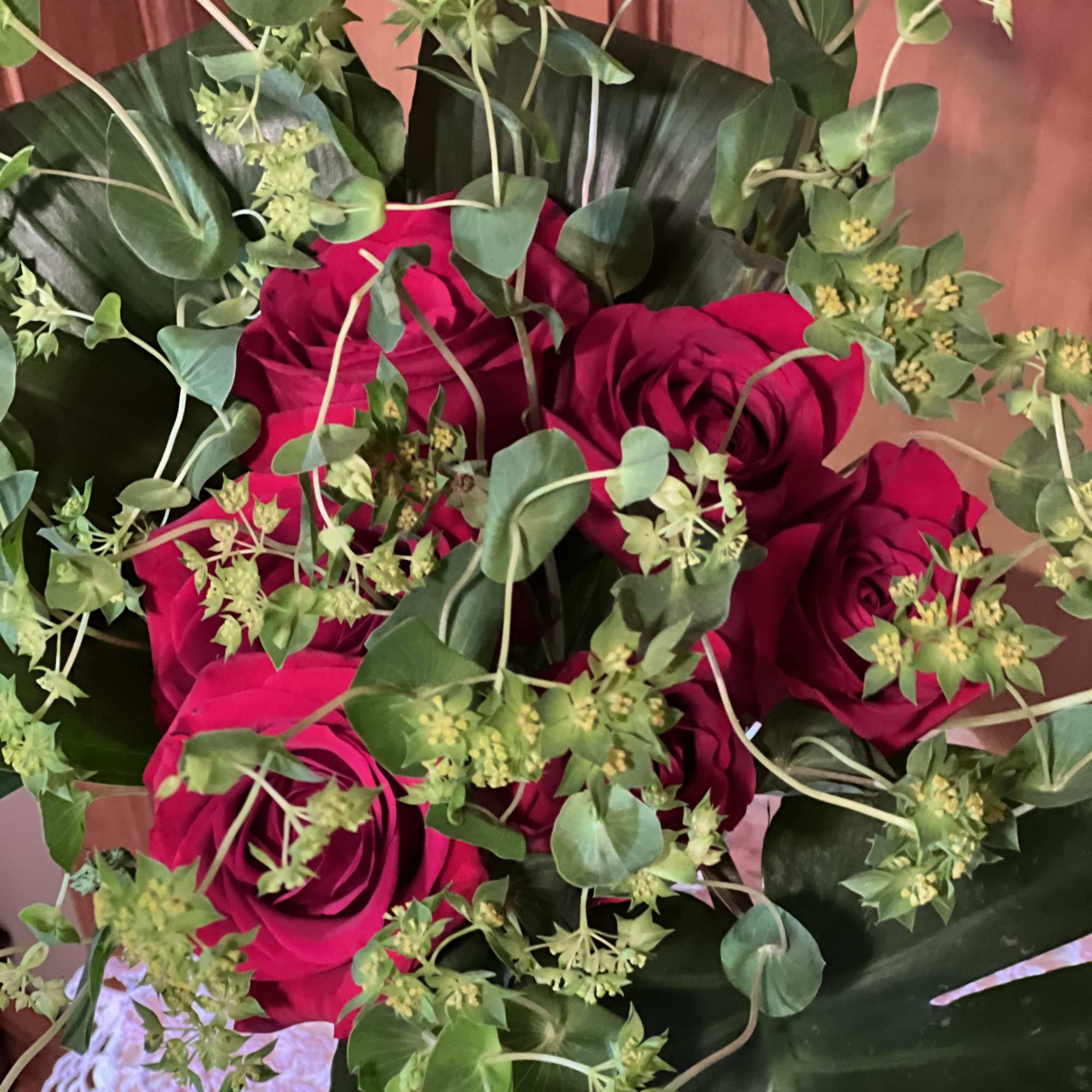 Bouquet of red roses with green foliage
