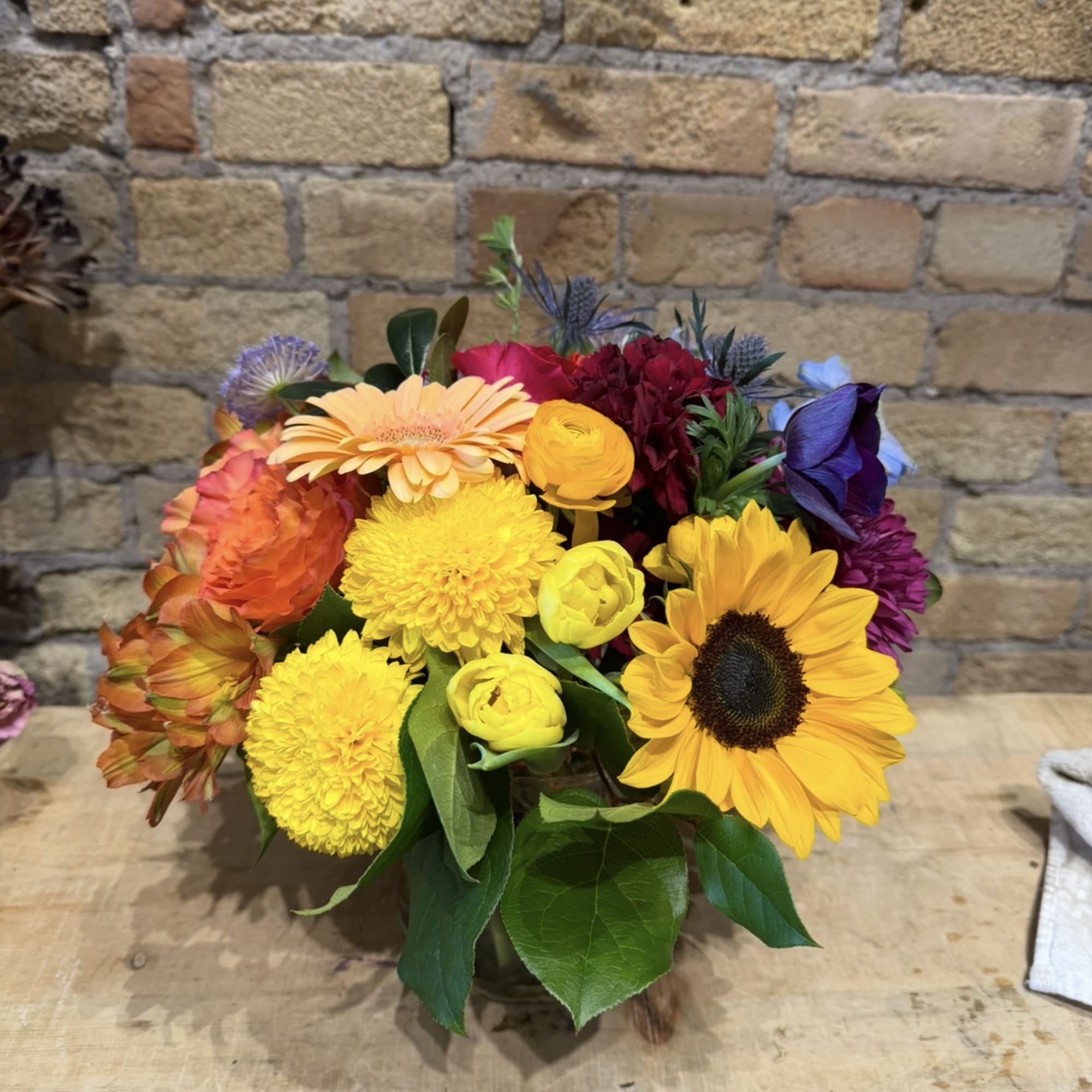Bright &amp; colorful, this arrangement is filled with seasonal flowers of each