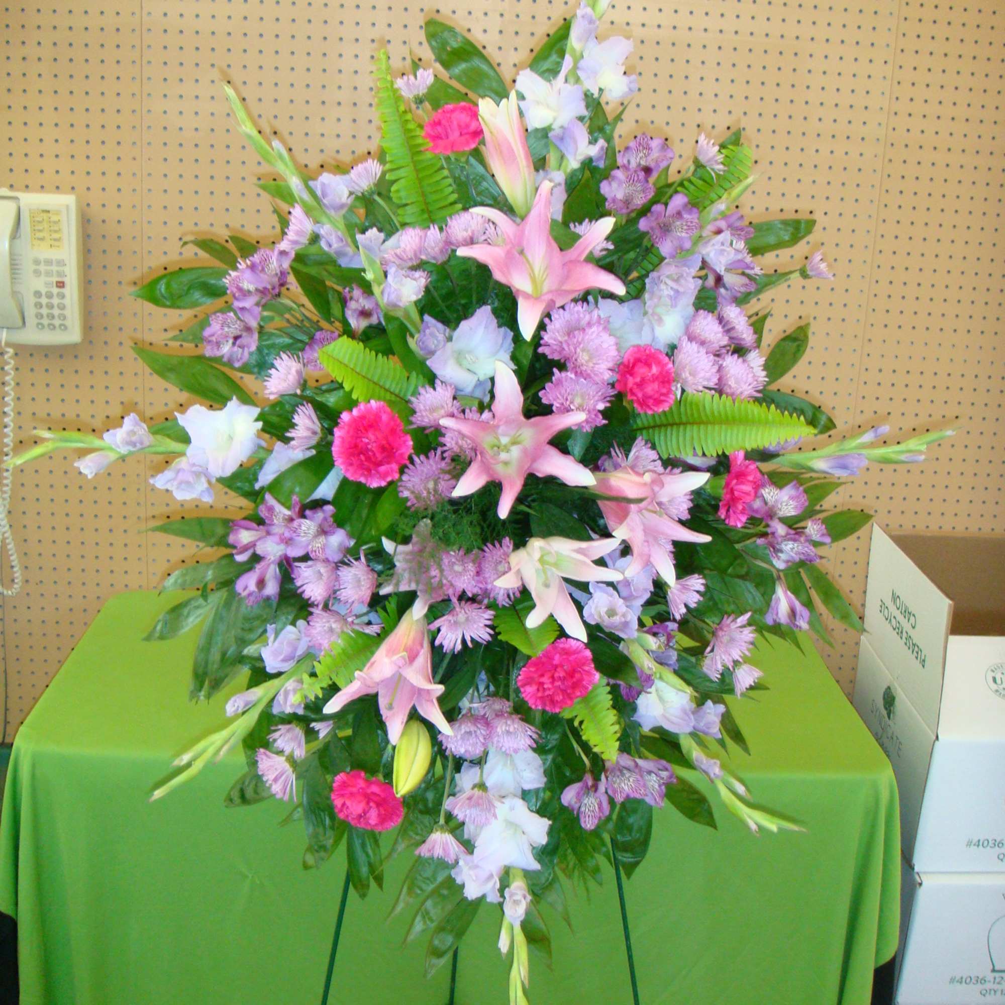 Large standing spray with pink lilies and lavender flowers