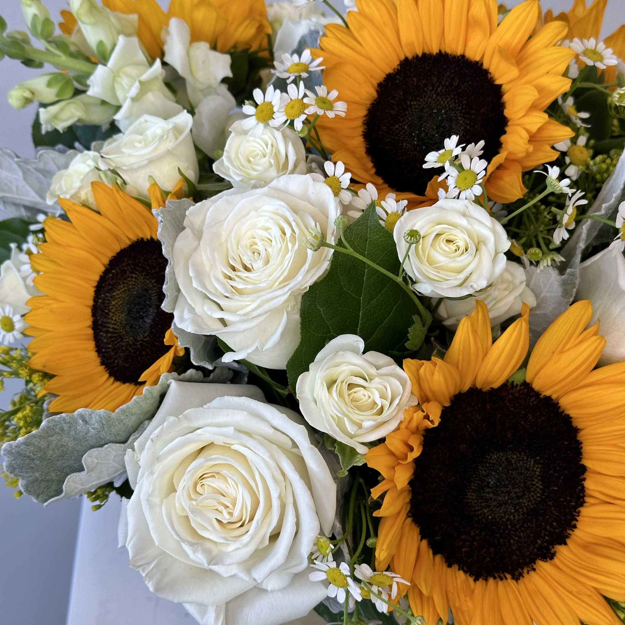 Discover the radiant beauty of our Golden Sunrise flower arrangement, a stunning