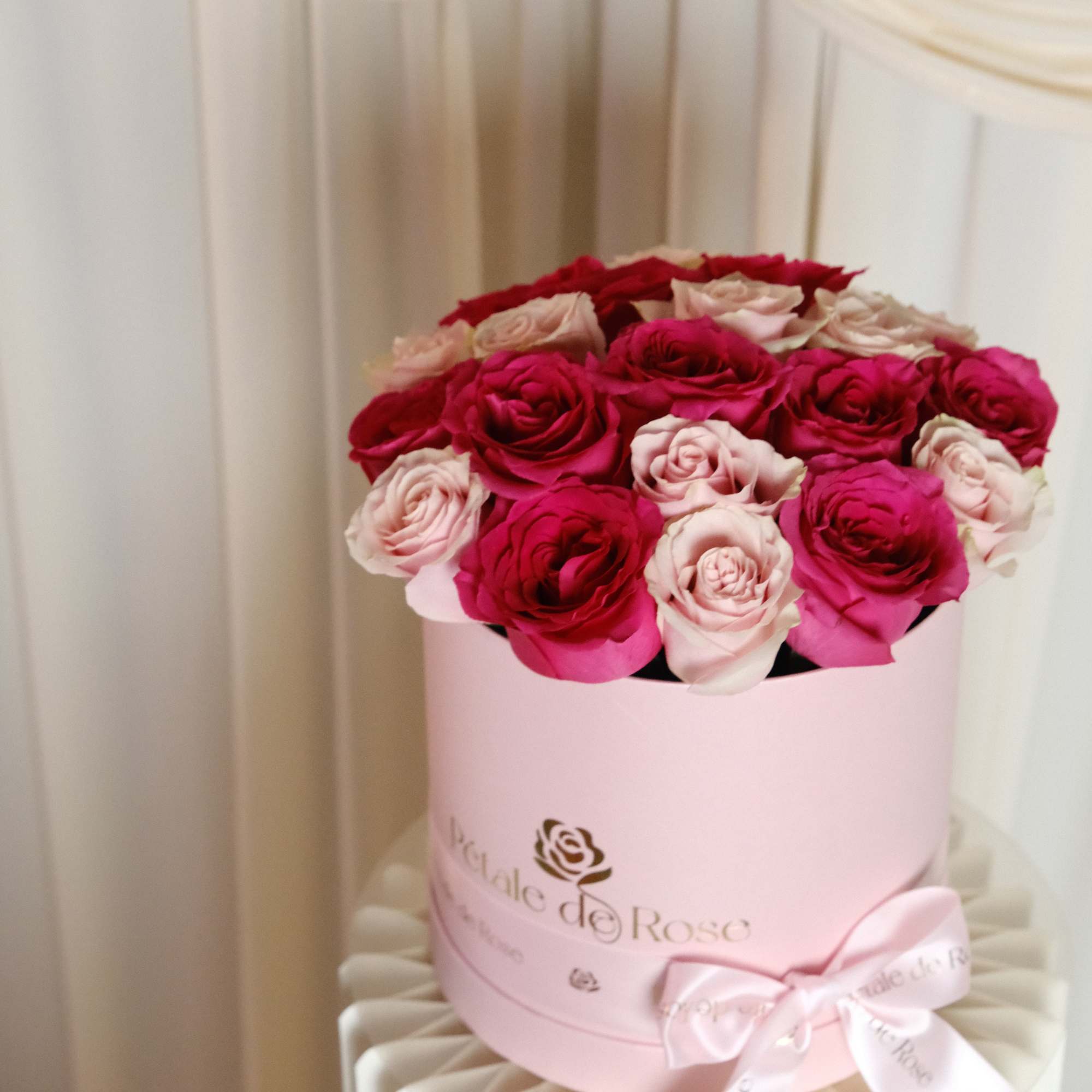 A romantic arrangement featuring premium pink and blush roses carefully designed in