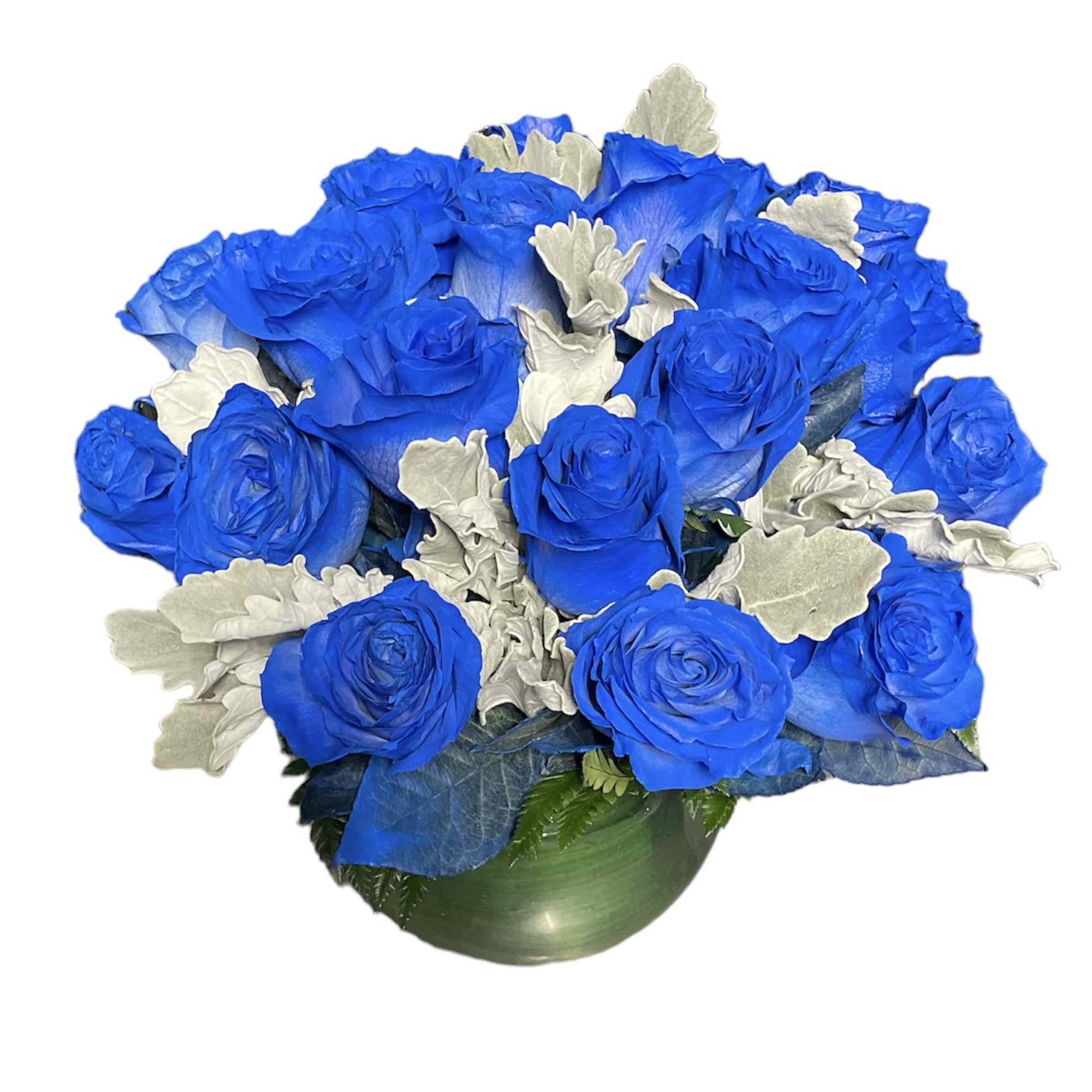 Blue roses arranged in a green vase with silver foliage