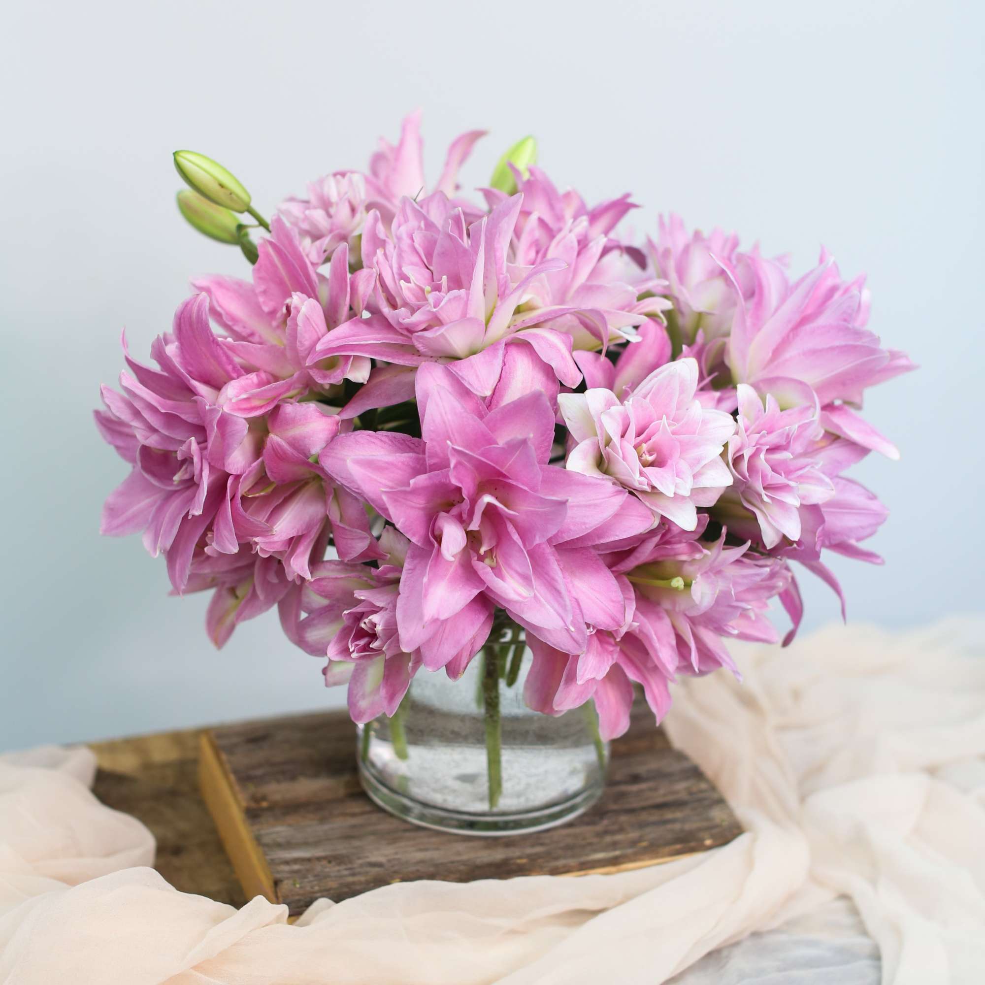 Pink lily bouquet in a clear glass vase