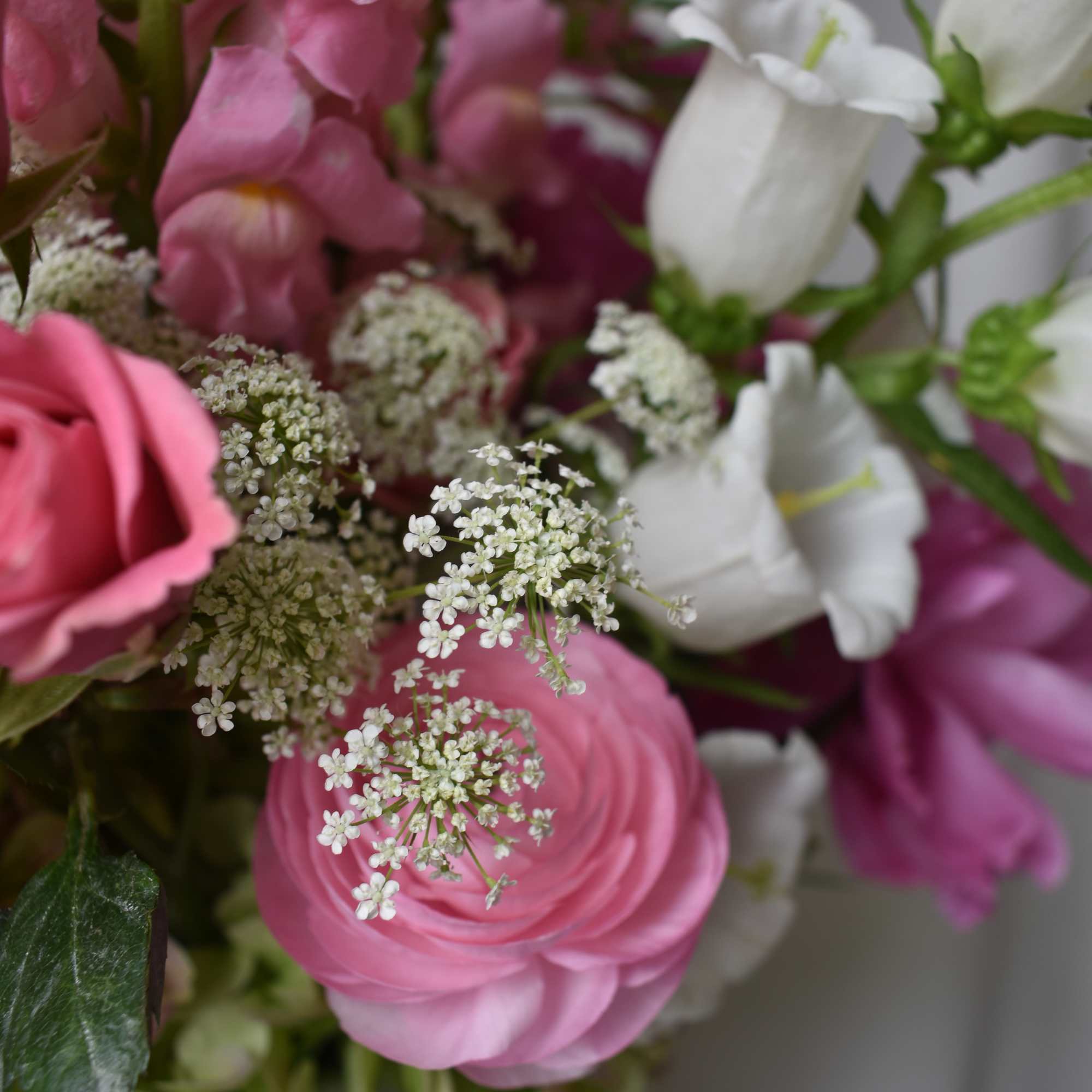 Pink and white mixed bouquet with ranunculus and bell-shaped blooms