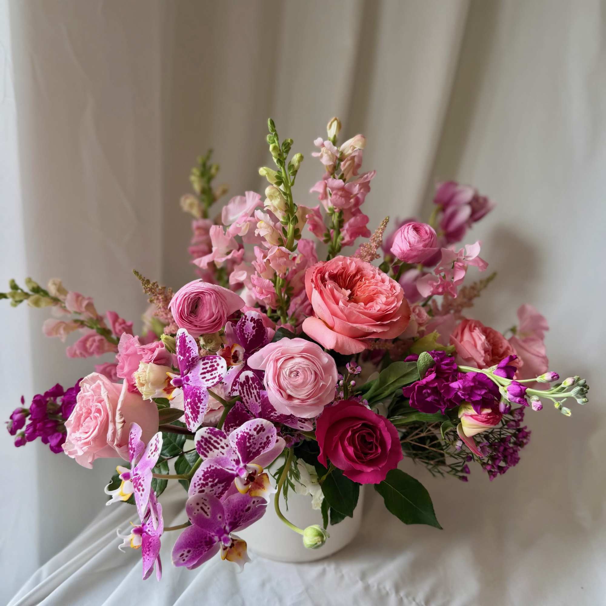 Hearts Aflame is a lush arrangement composed of seasonal locally sourced flowers
