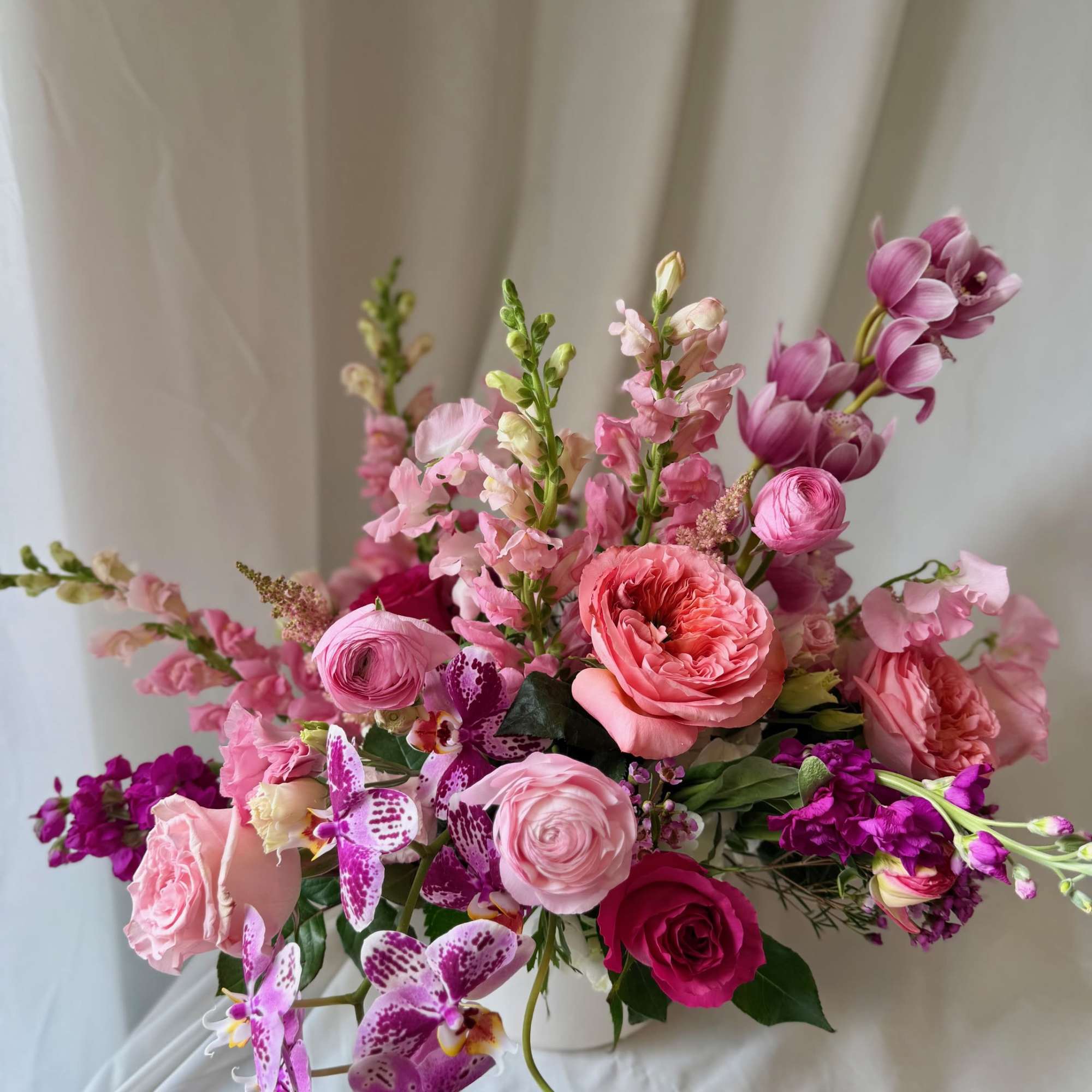 Hearts Aflame is a lush arrangement composed of seasonal locally sourced flowers