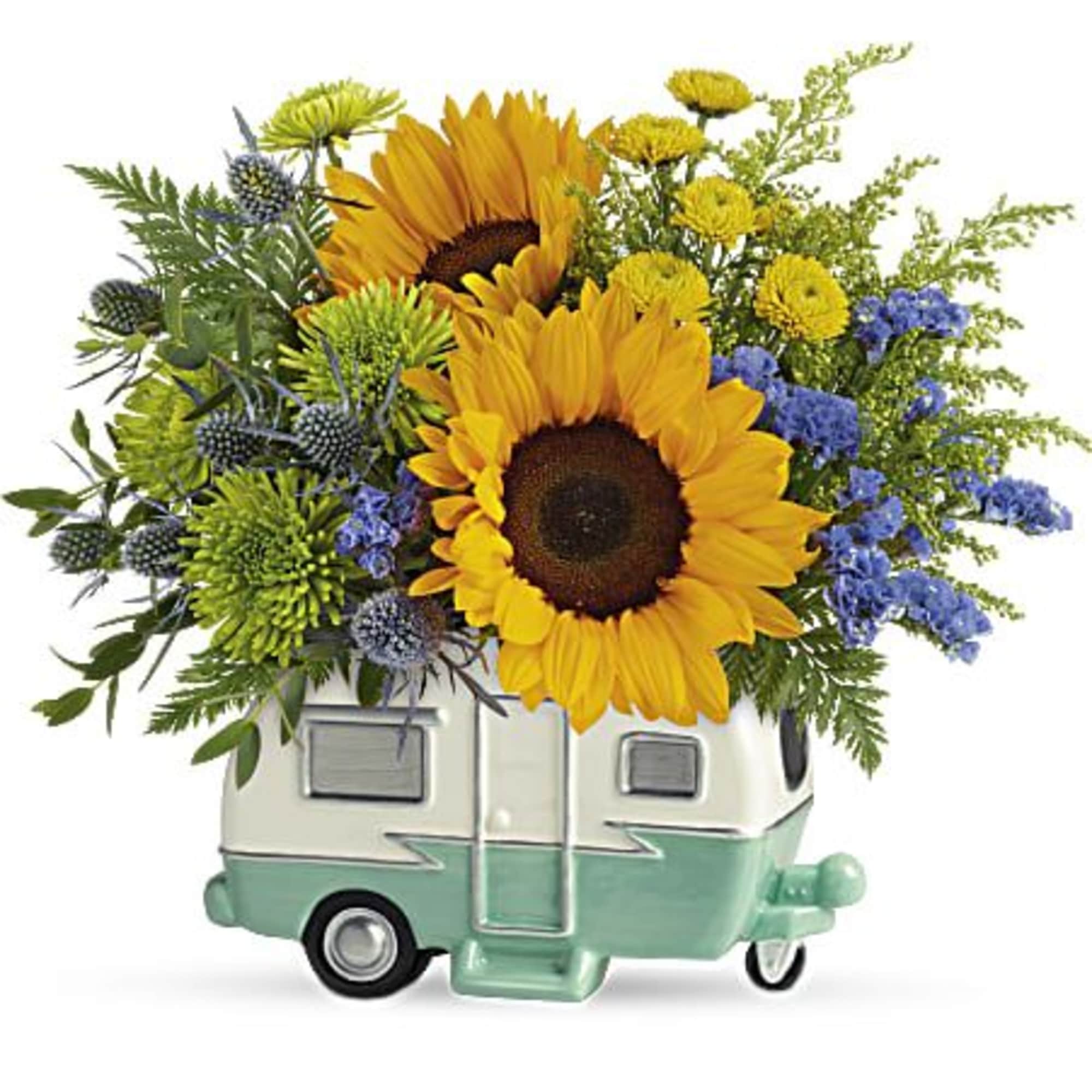 Sunflowers and mixed blooms arranged in a small camper-shaped container