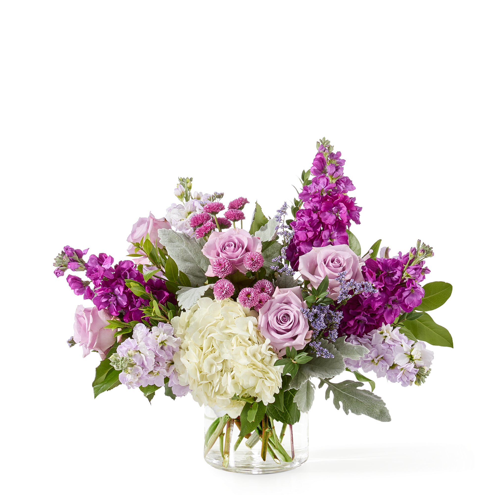 A soft, elegant mix of lavender roses, magenta stock, white hydrangeas, and