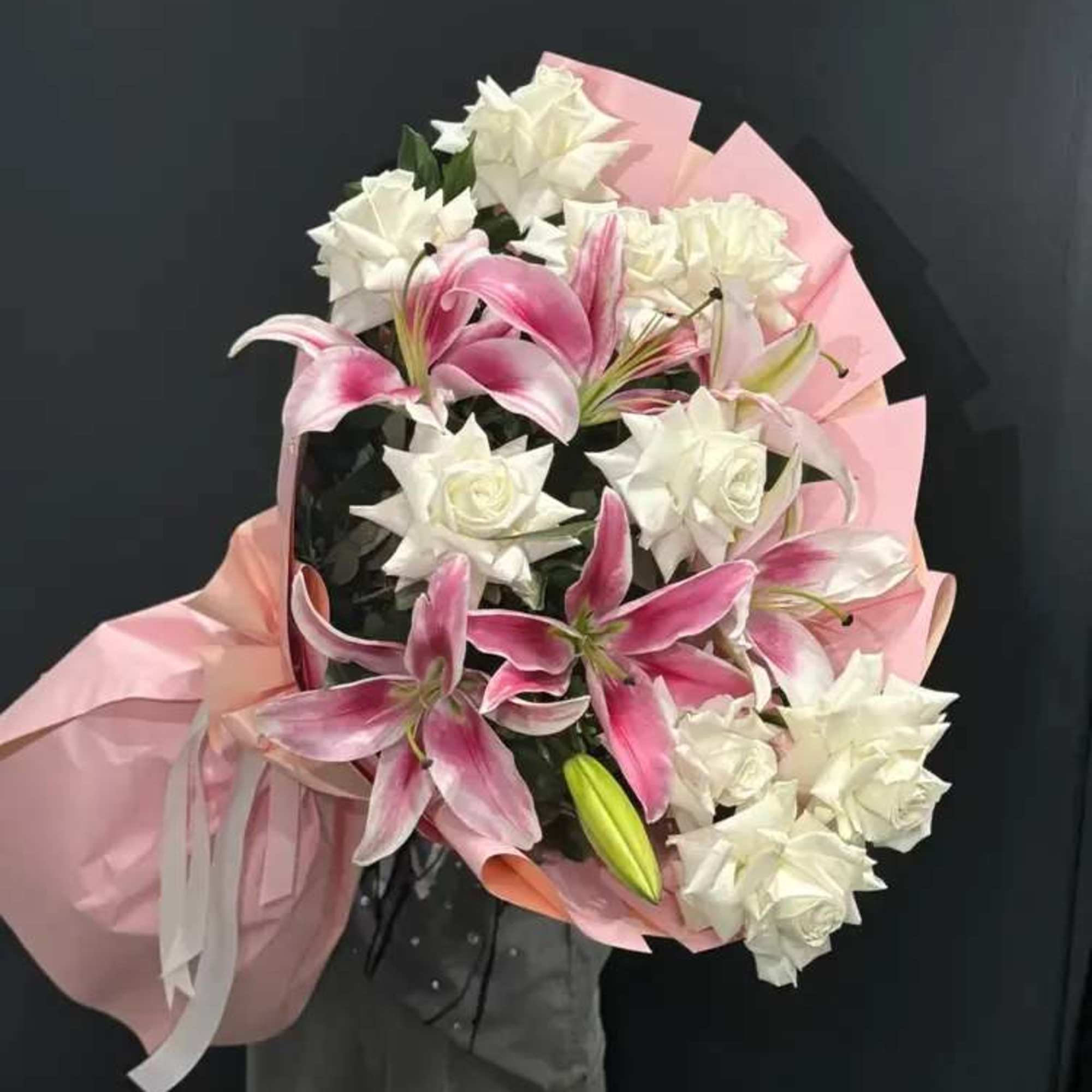 Blush Lily Charm is a timeless and expressive bouquet that combines the