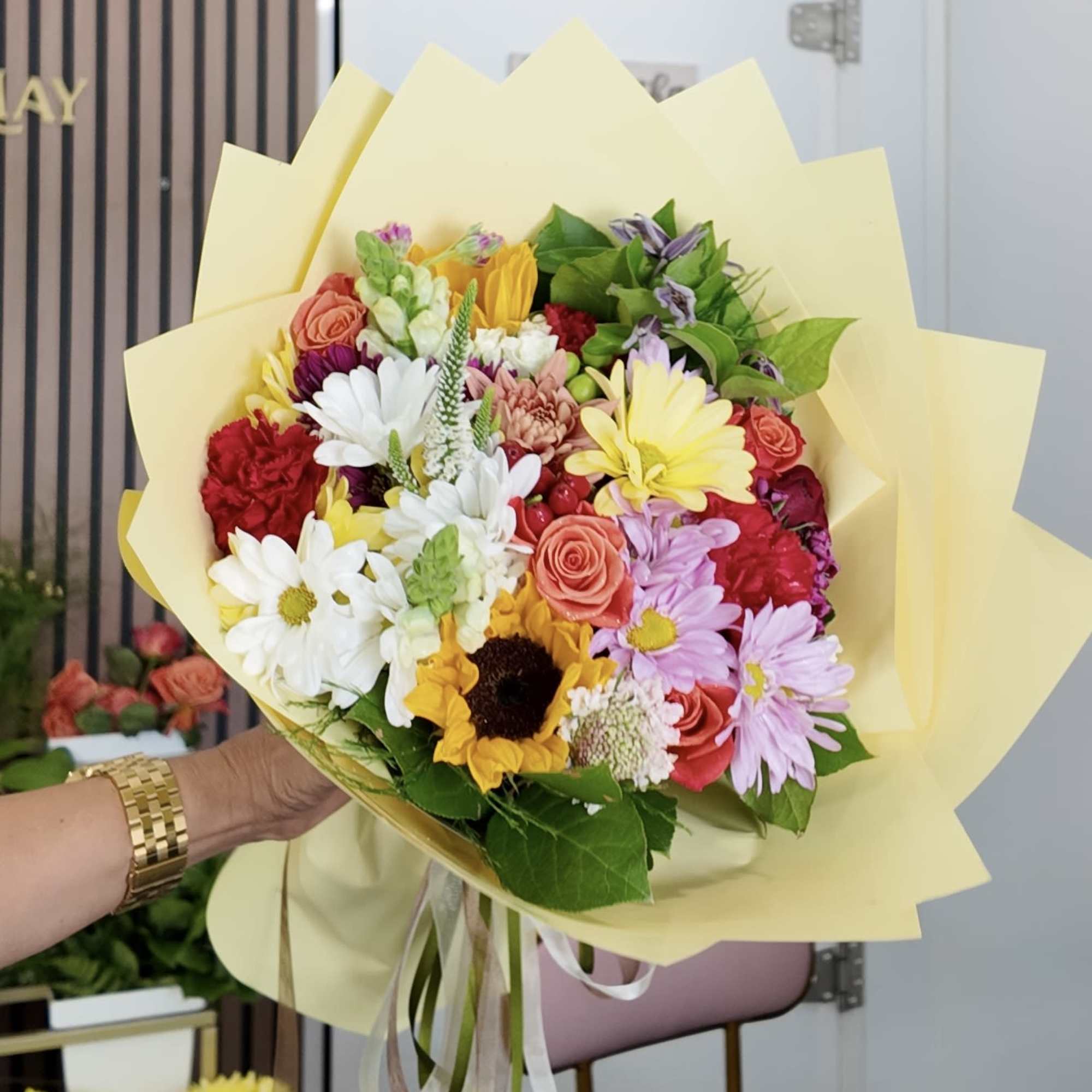 A lively mixed-color bouquet that reads like sunshine in your hands, Rain