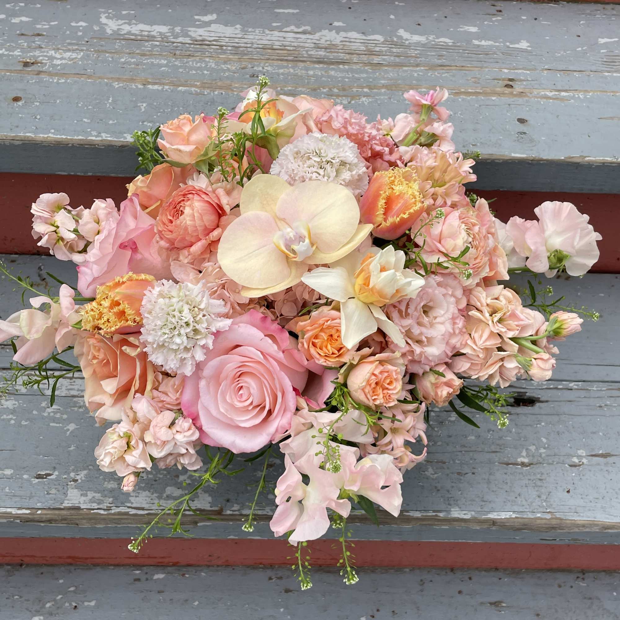 A lovely peach arrangement with a monochromatic peachy pink color scheme. This