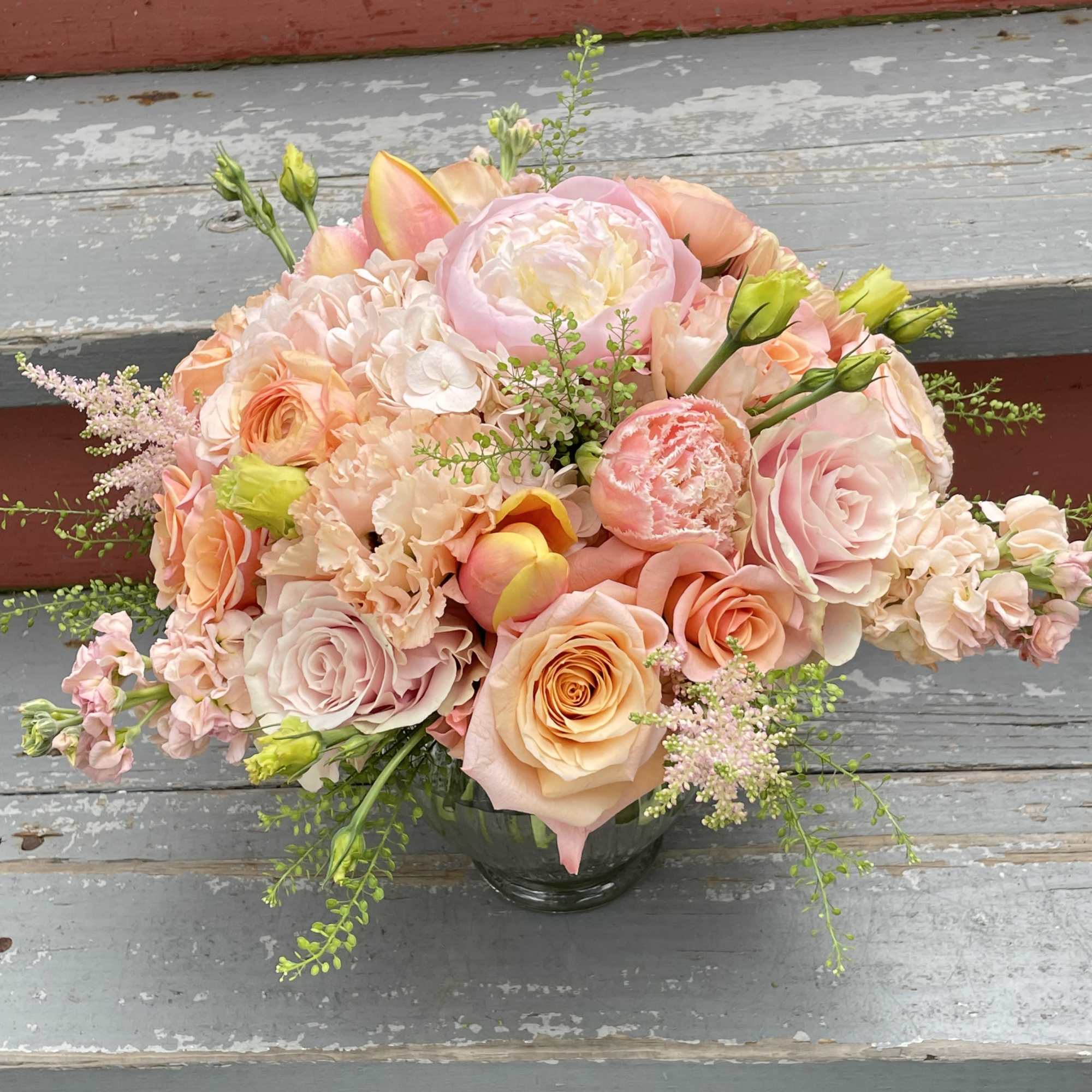 A lovely peach arrangement with a monochromatic peachy pink color scheme. This