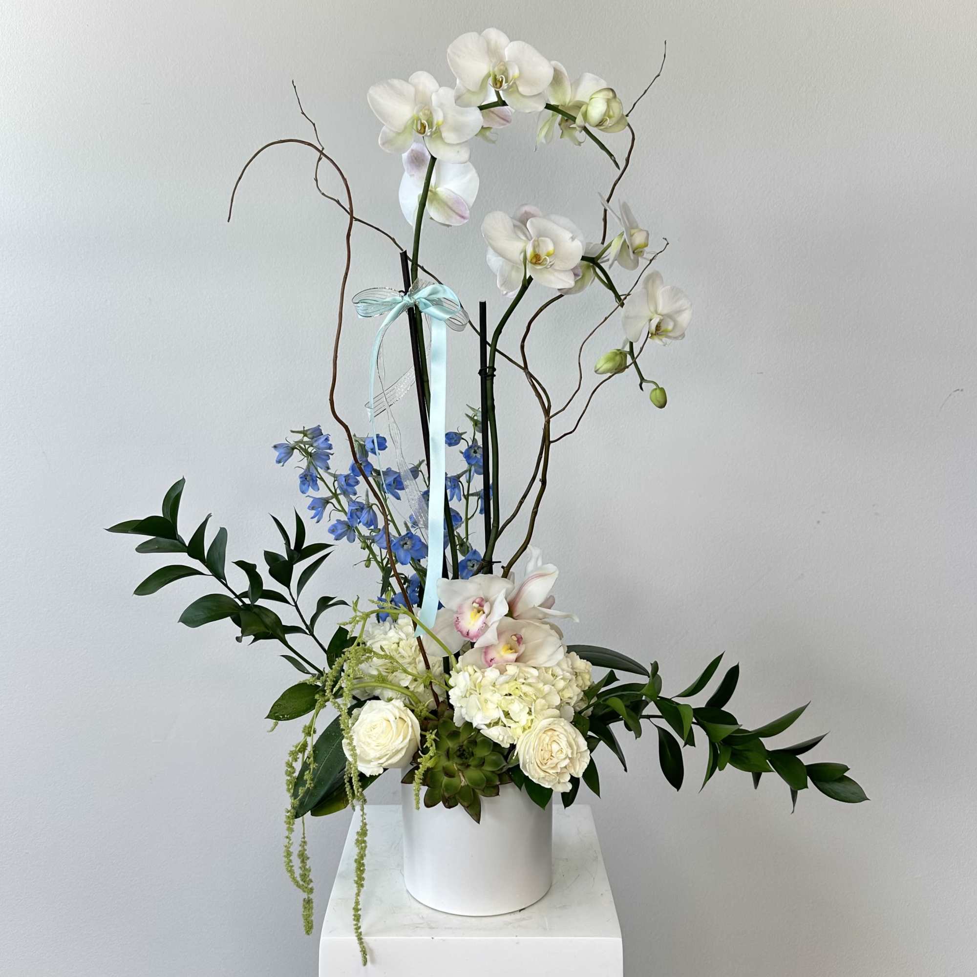 Step into paradise with "Eden," an exquisite luxury orchid arrangement that captures