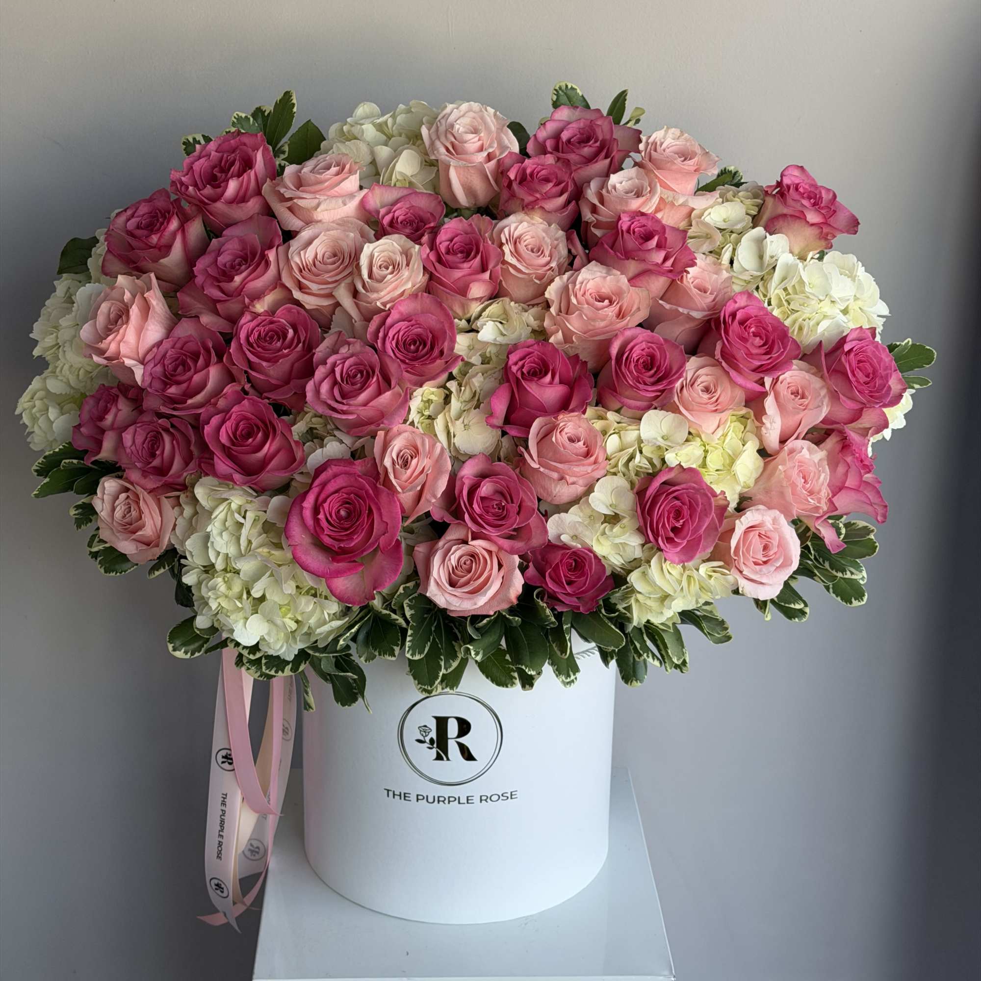 A charming arrangement with roses in two elegant shades of pink &mdash;