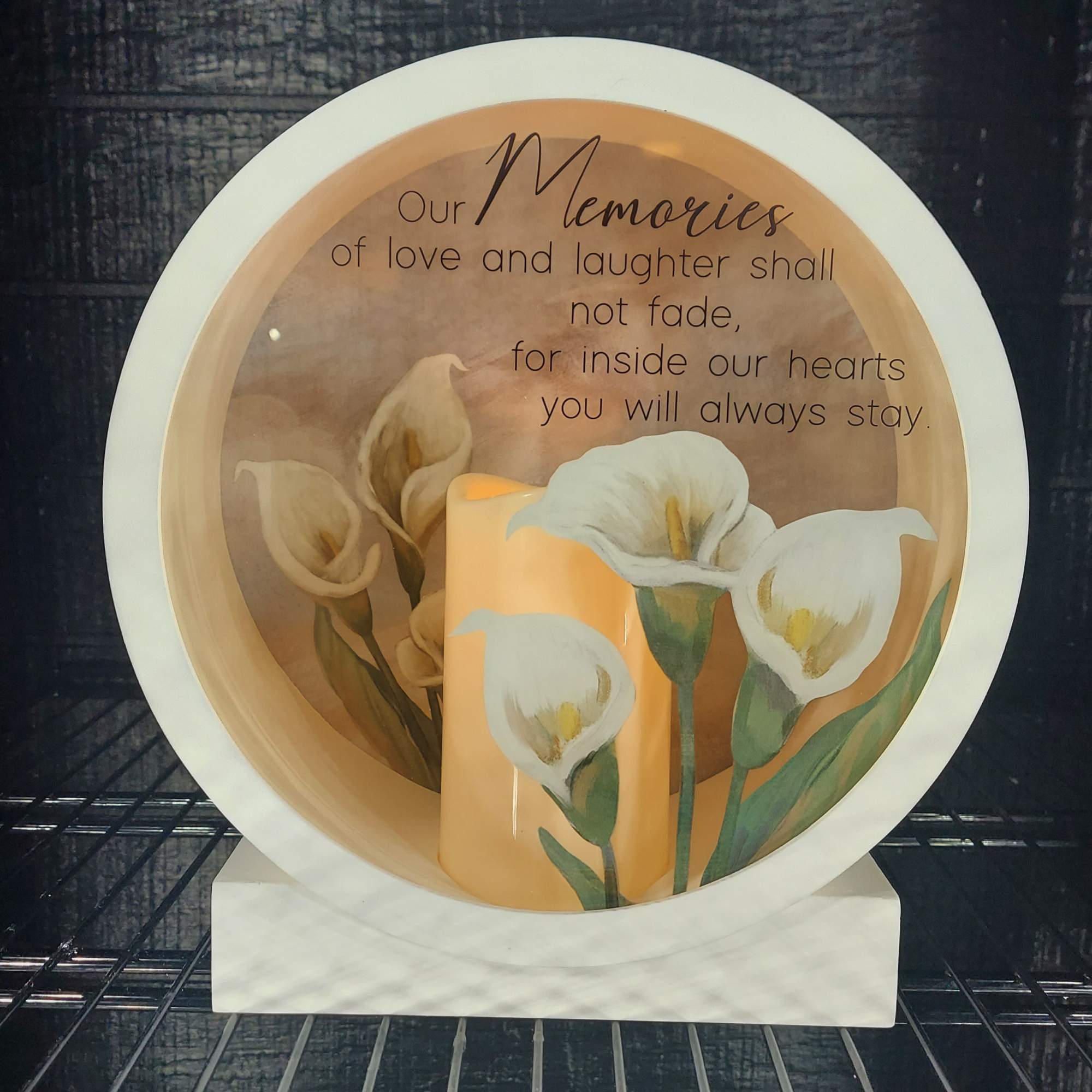 Decorative memorial plate with white calla lilies and a remembrance message