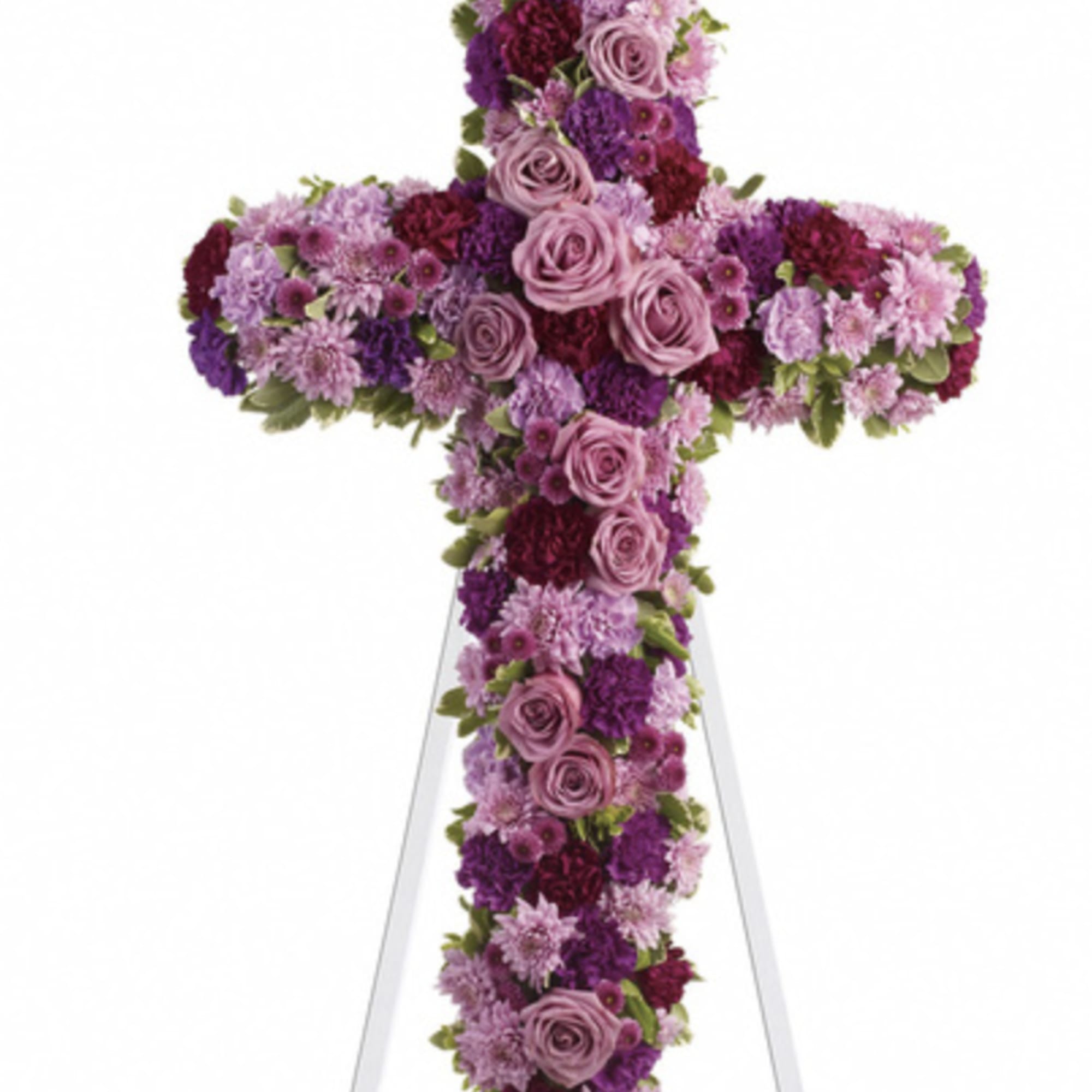 A beautiful cross-shaped standing spray featuring an assortment of pink and purple
