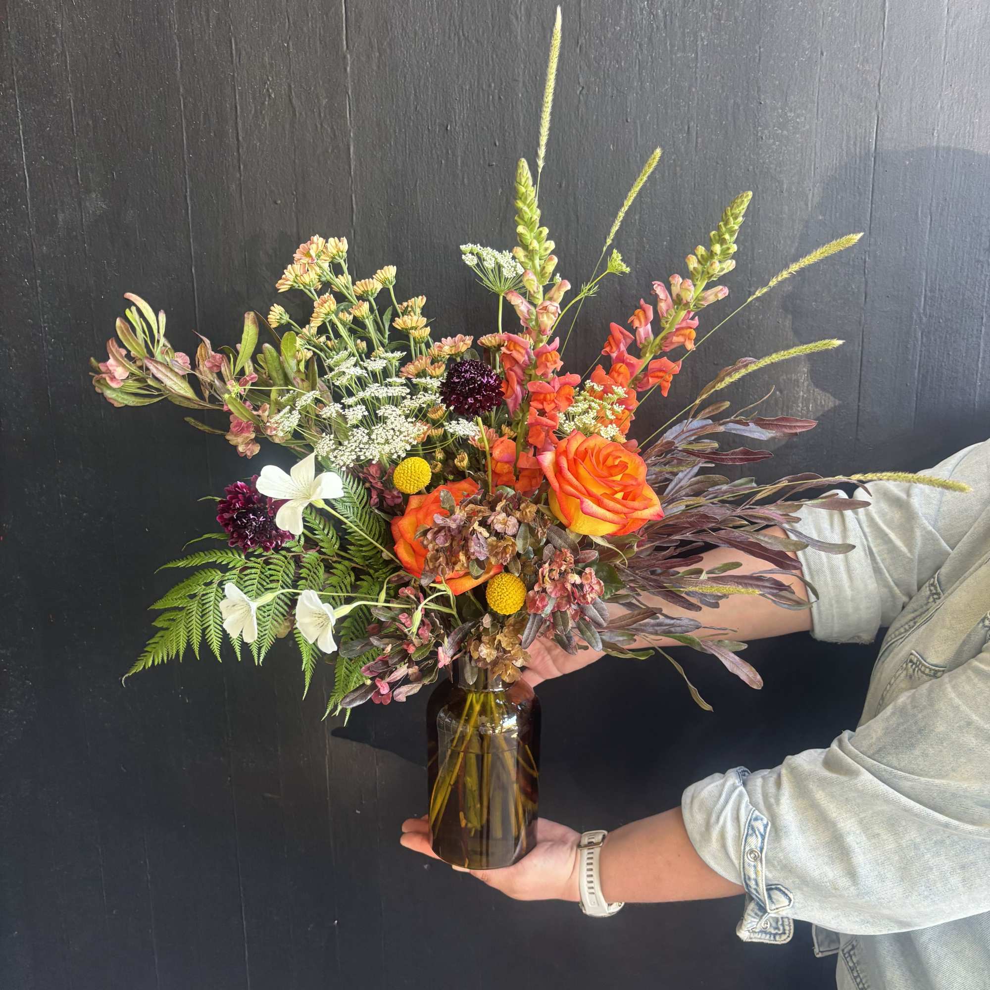 A mix of unique flowers like scabiosa, Queen Anne's Lace and snapdragons.