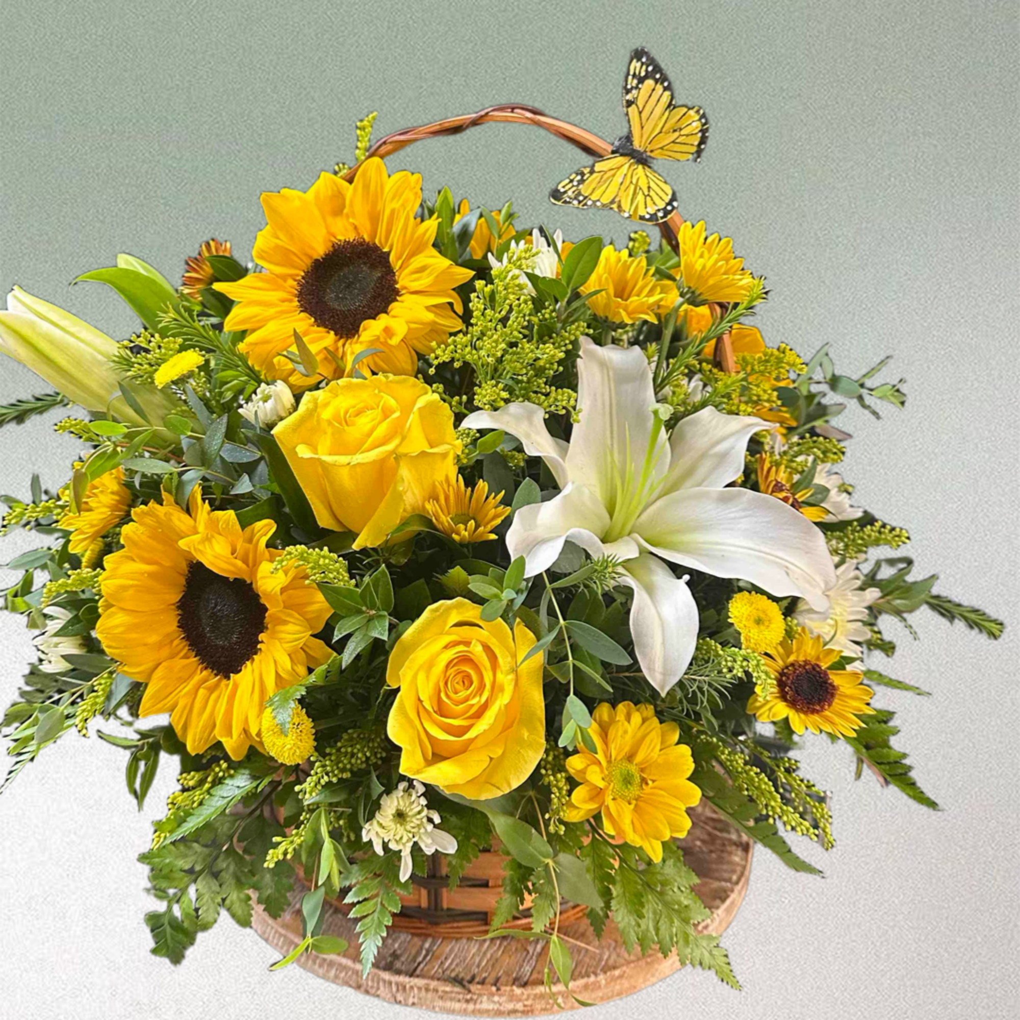 Basket with yellow roses, sunflowers, and lilies