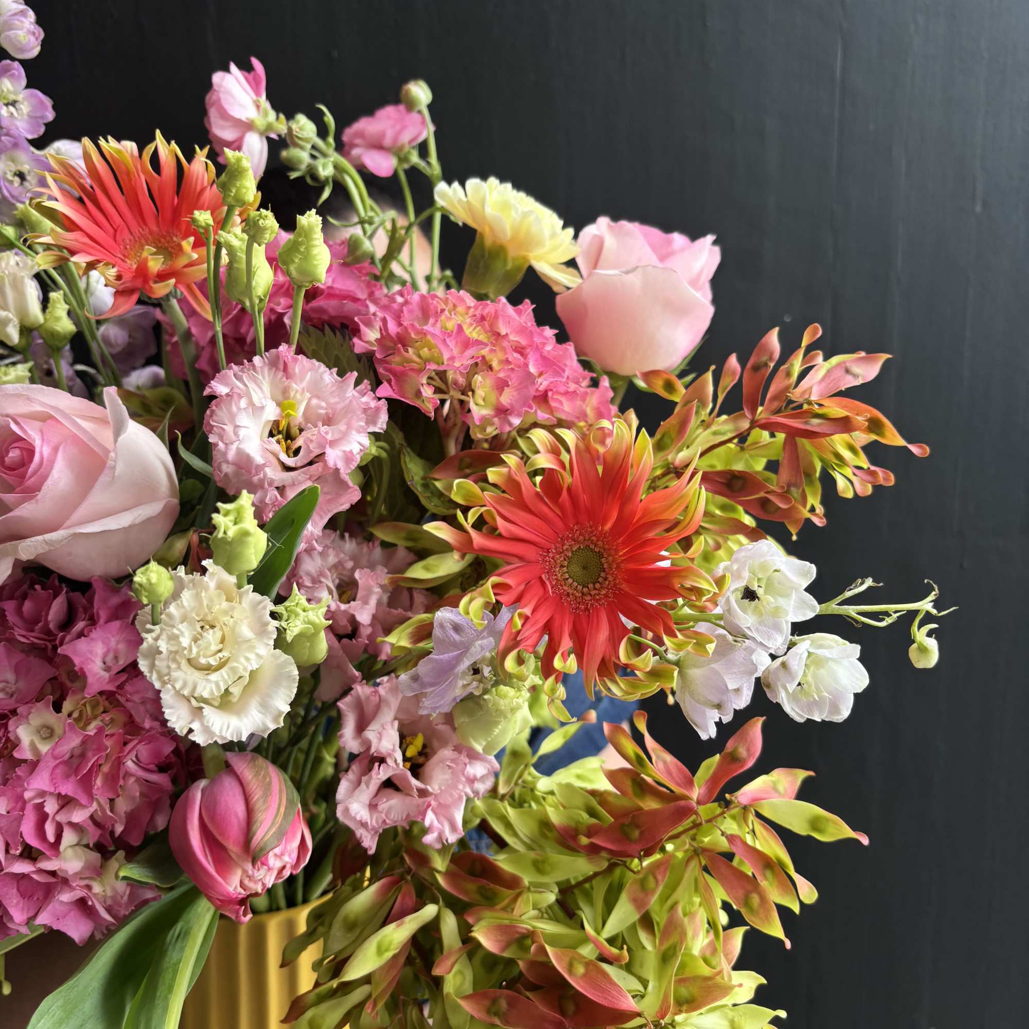A Bright and refreshing design of garden hydrangeas, roses, and tulips. 

Our