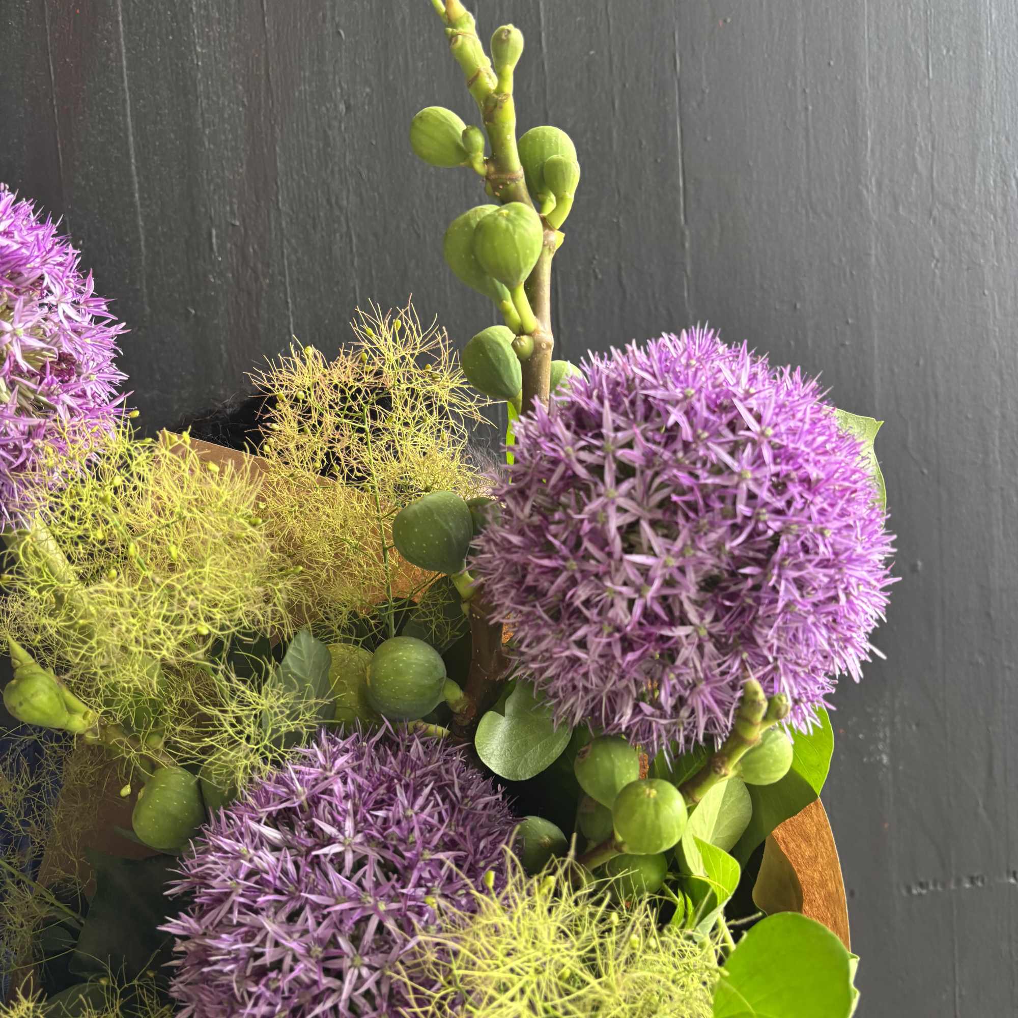 A design of Allium and Fig Branches mixed with local ivy and