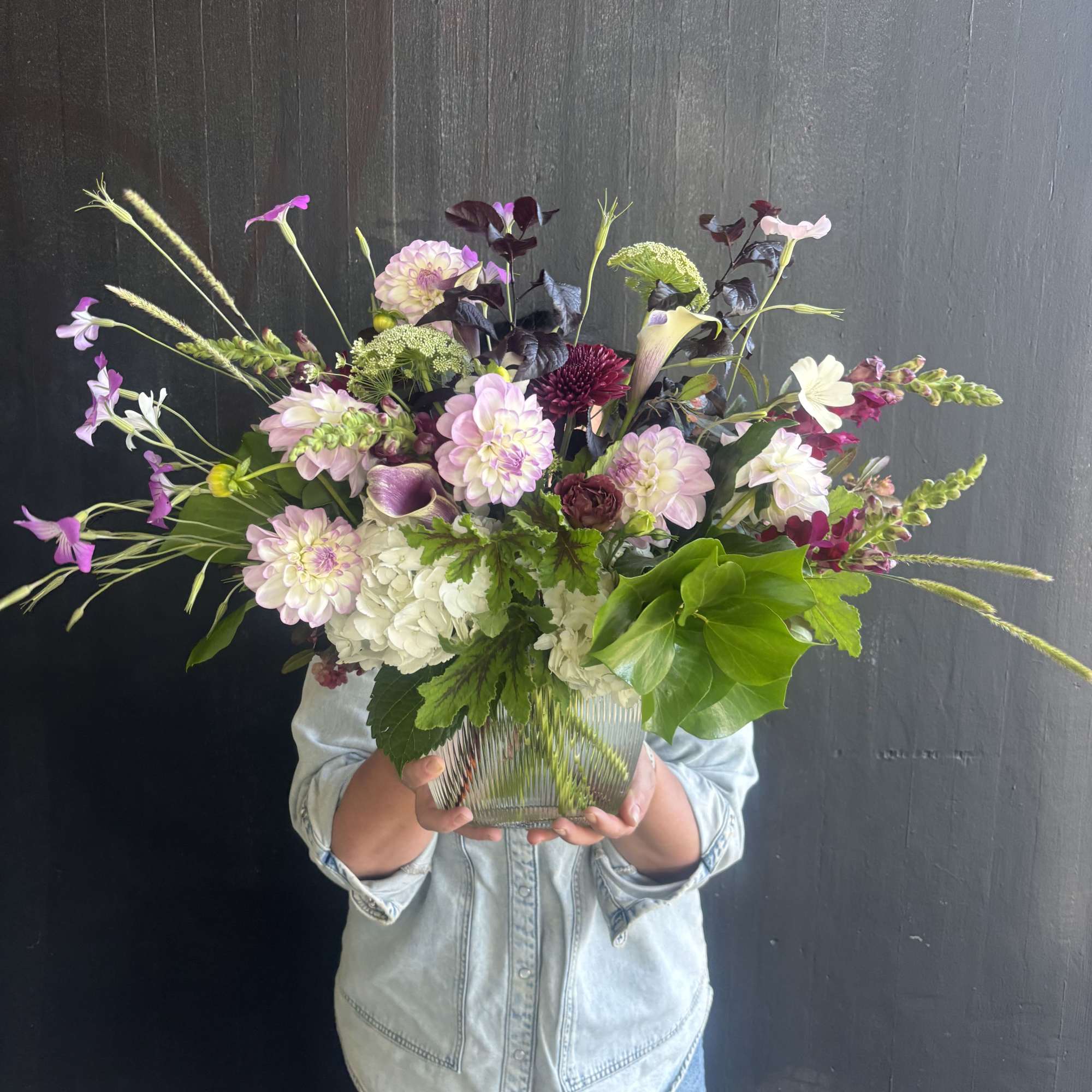 A beautiful mix of locally grown dahlias, scabiosa, and garden hydrangeas. Accentuated