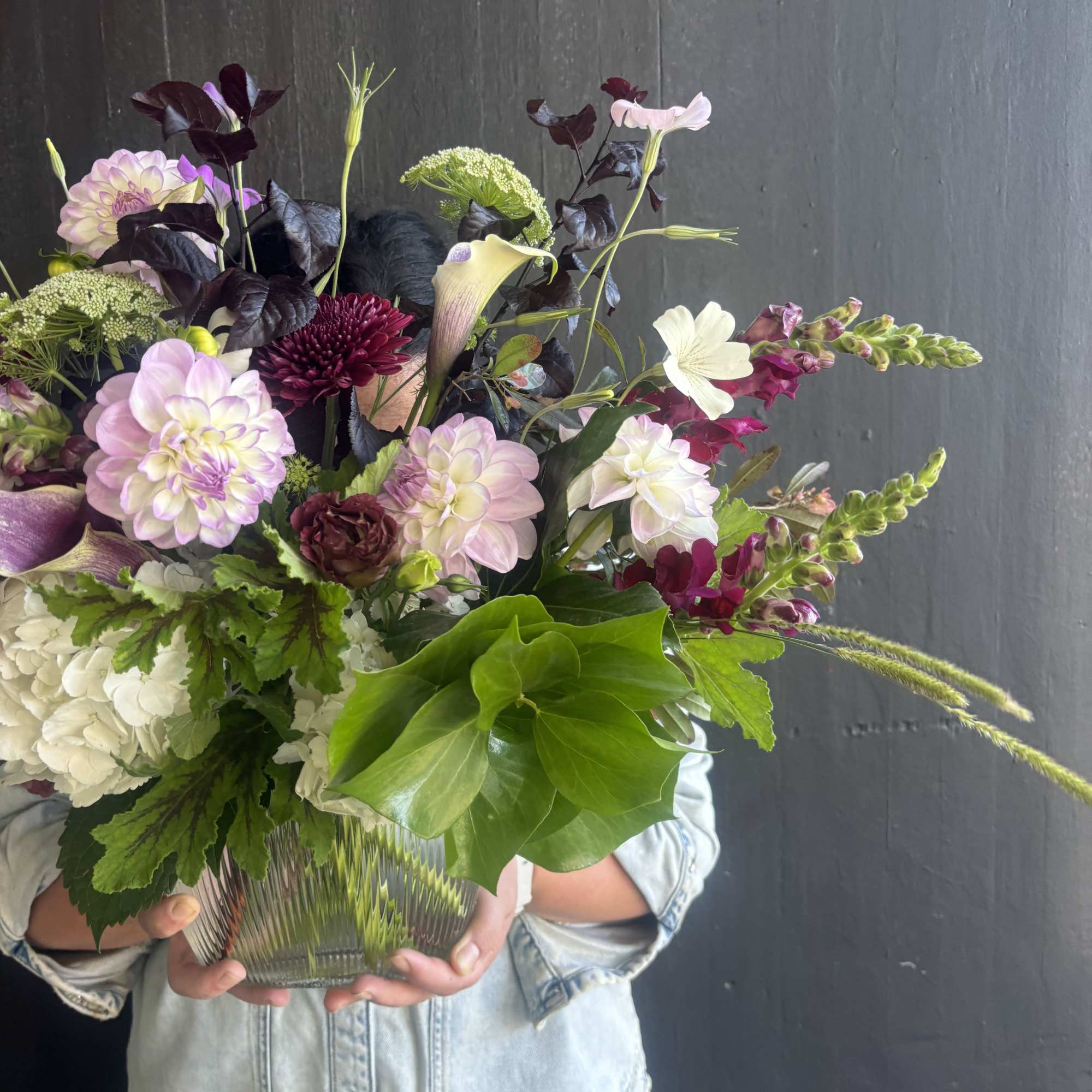 A beautiful mix of locally grown dahlias, scabiosa, and garden hydrangeas. Accentuated