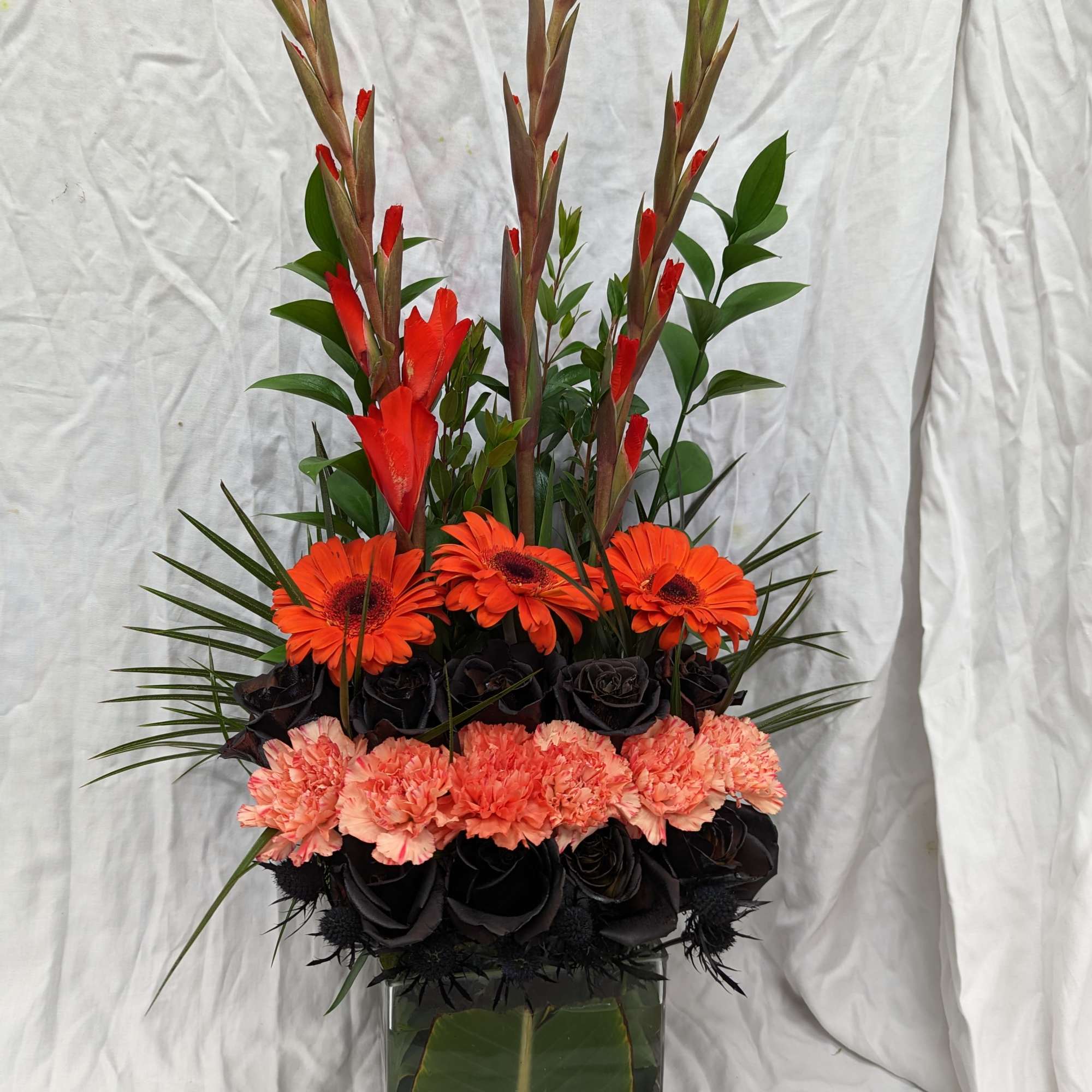 Orange and black flowers were requested for a Harley Davidson member's memorial