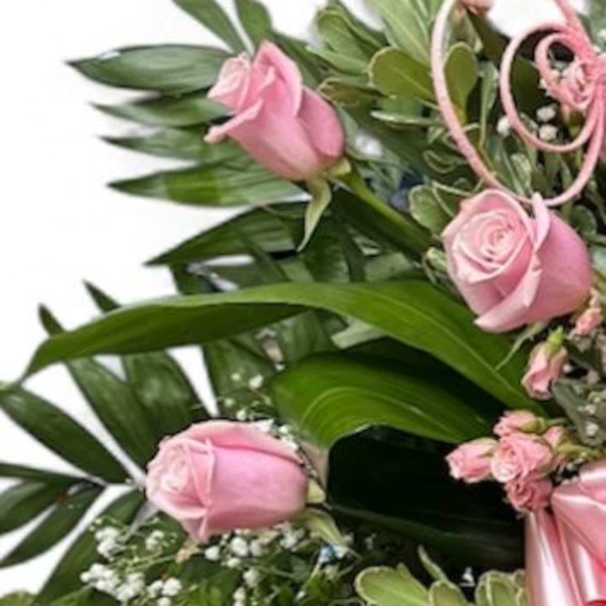 Express heartfelt condolences with this stunning pink rose sympathy floor basket, designed