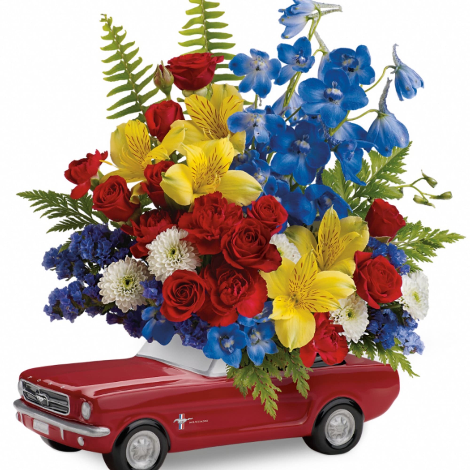 Bouquet of red, yellow, and blue flowers arranged in a red toy car