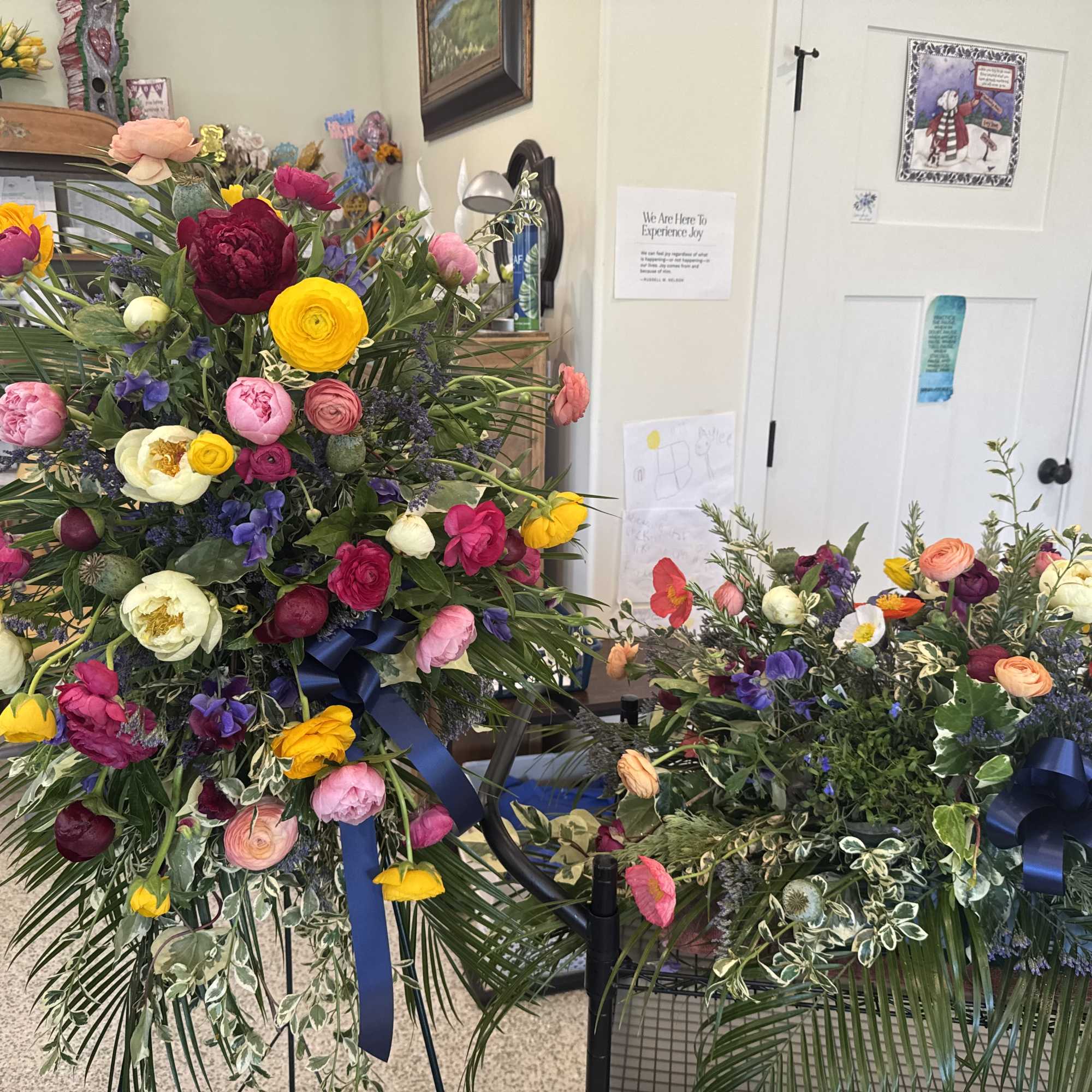 assortment of flowers and greenery to go on top of the casket.