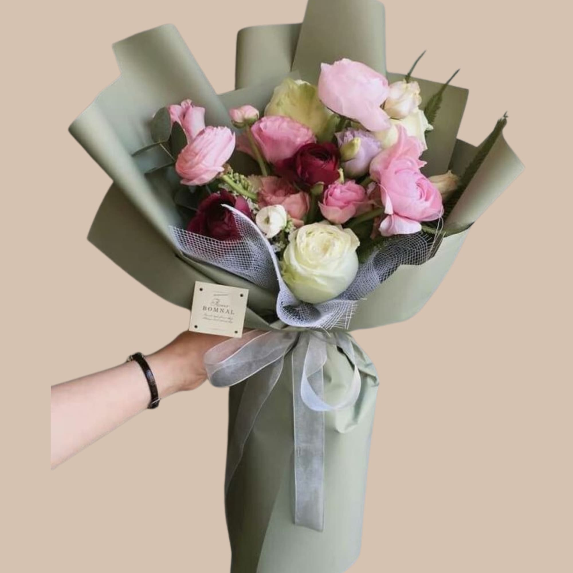Lush, layered peony blooms in soft pink, creamy white, and deeper magenta