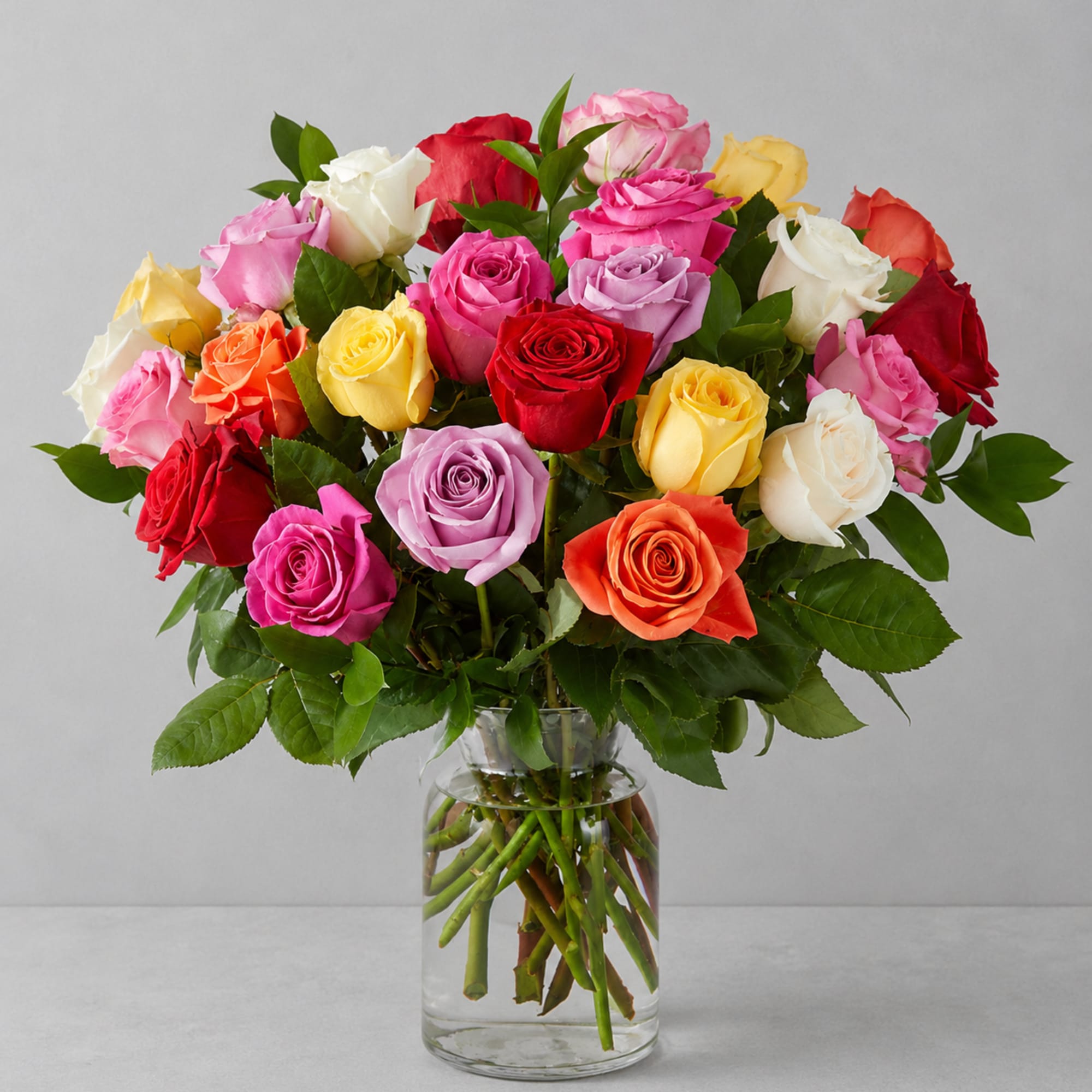 Colorful and entrancing, this bright bouquet of multicolored roses is an instant