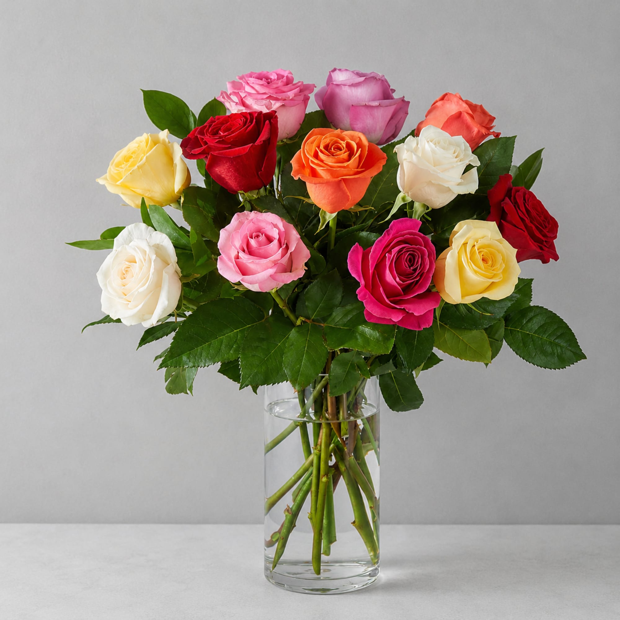 Colorful and entrancing, this bright bouquet of multicolored roses is an instant