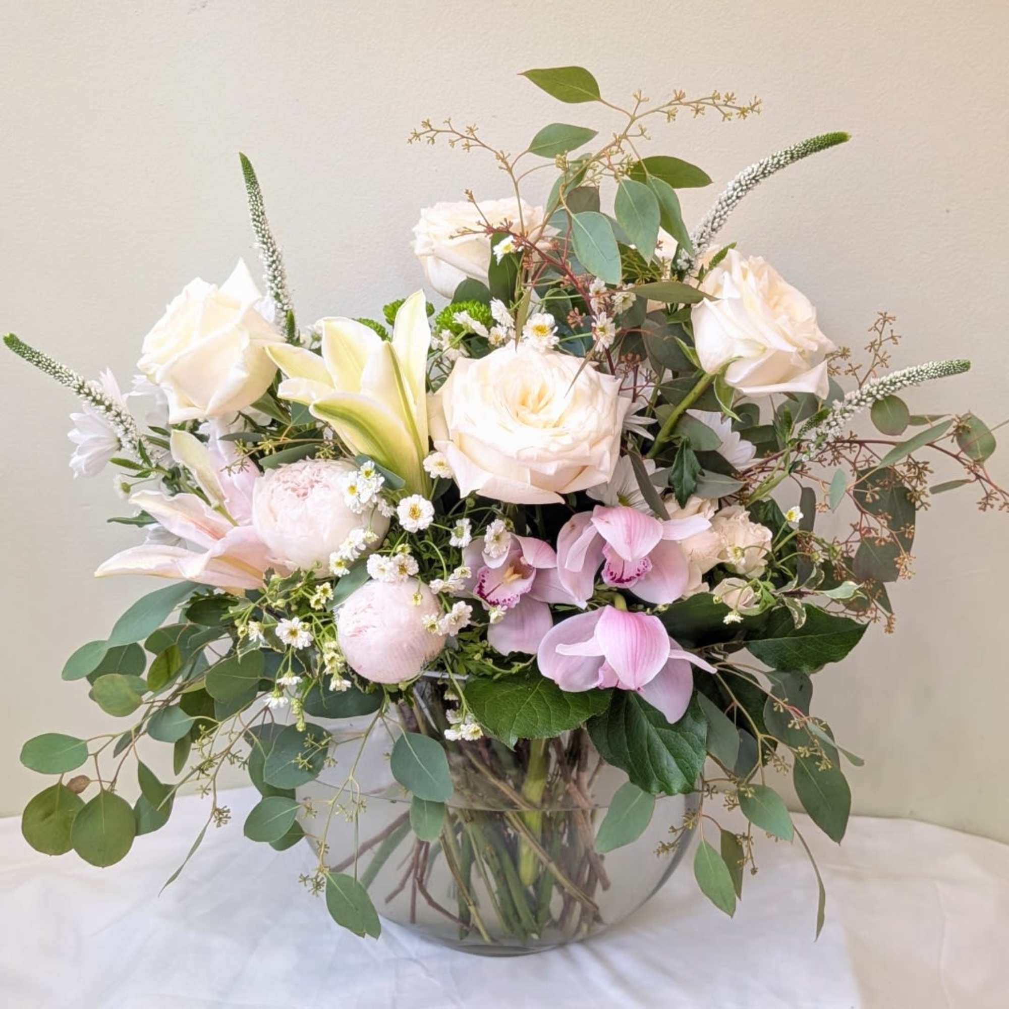 Blush Serenity is a graceful and elegant arrangement designed with white and