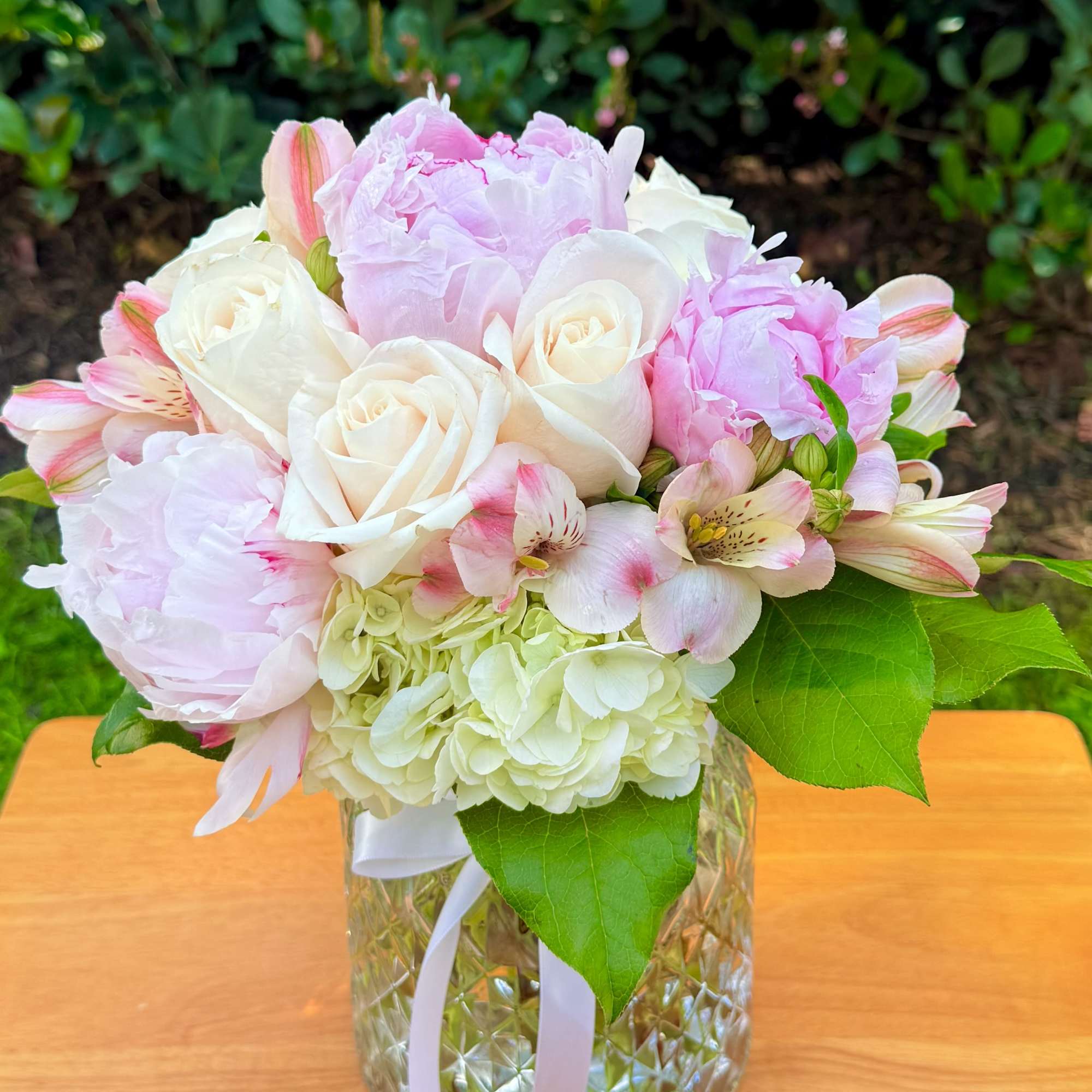 Pink and white bouquet in a glass vase