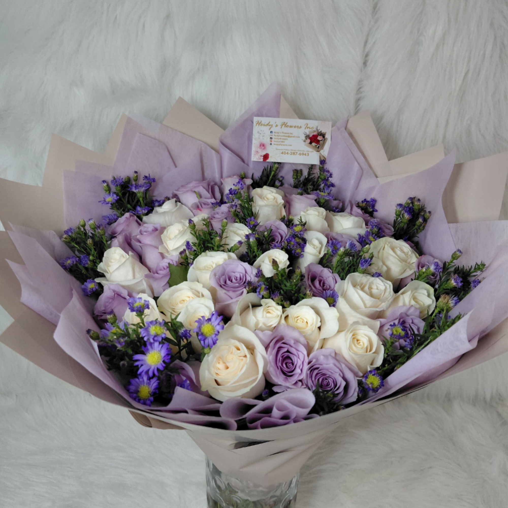 A cloud of lavender and white roses creates an immediate sense of
