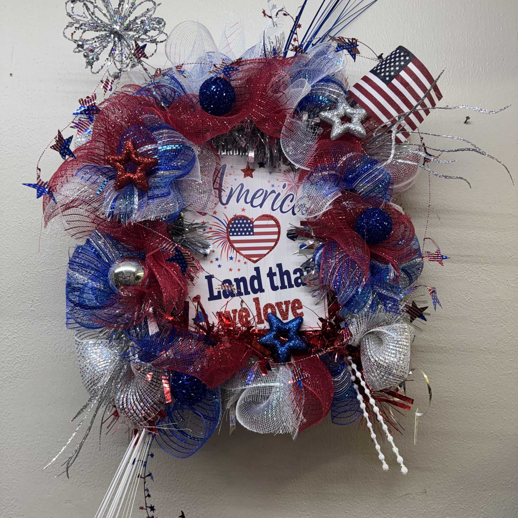 Let's celebrate America with this beautiful one-of-a-kind mesh door wreath! 