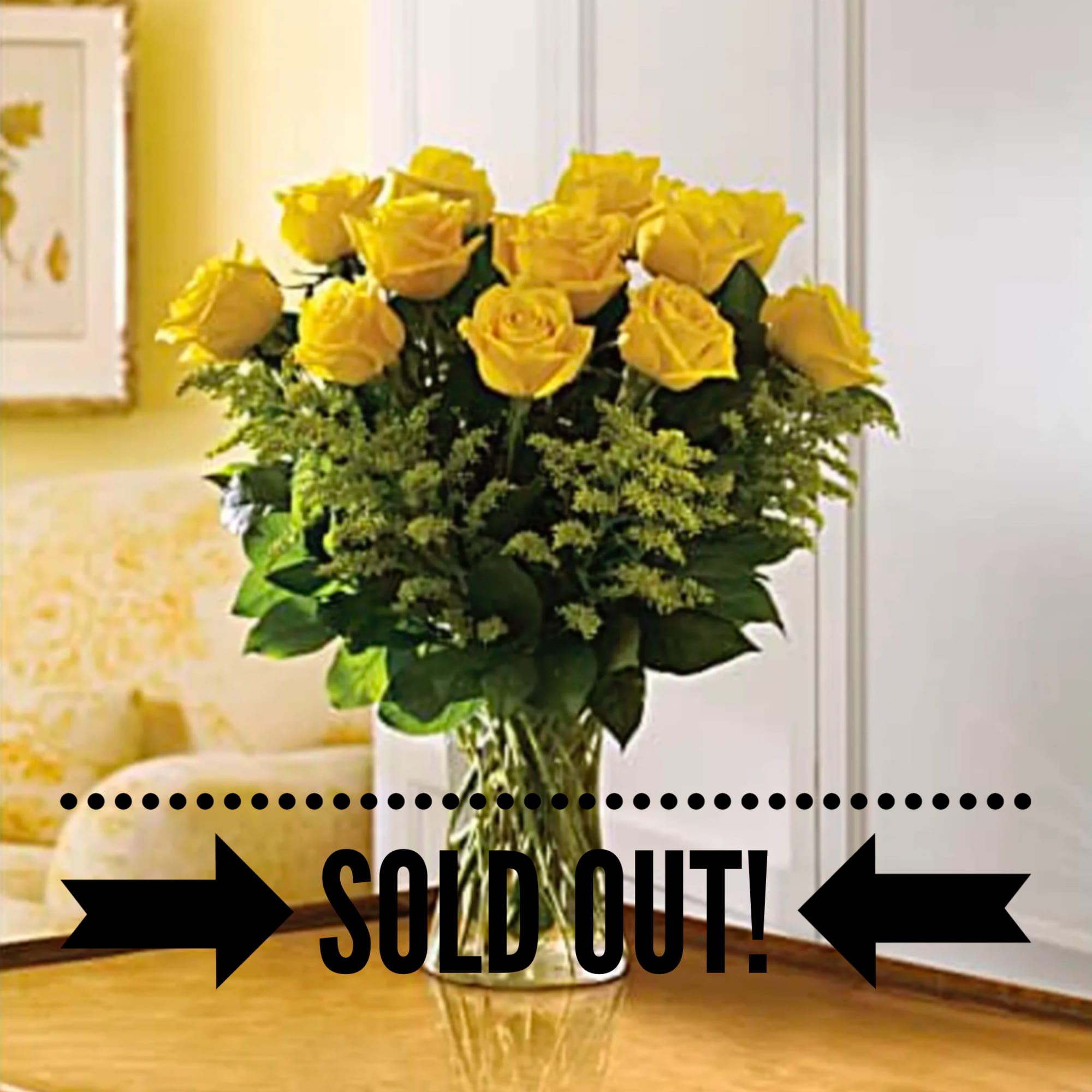 Glowing yellow roses and solidago mixed with greens are delivered in a