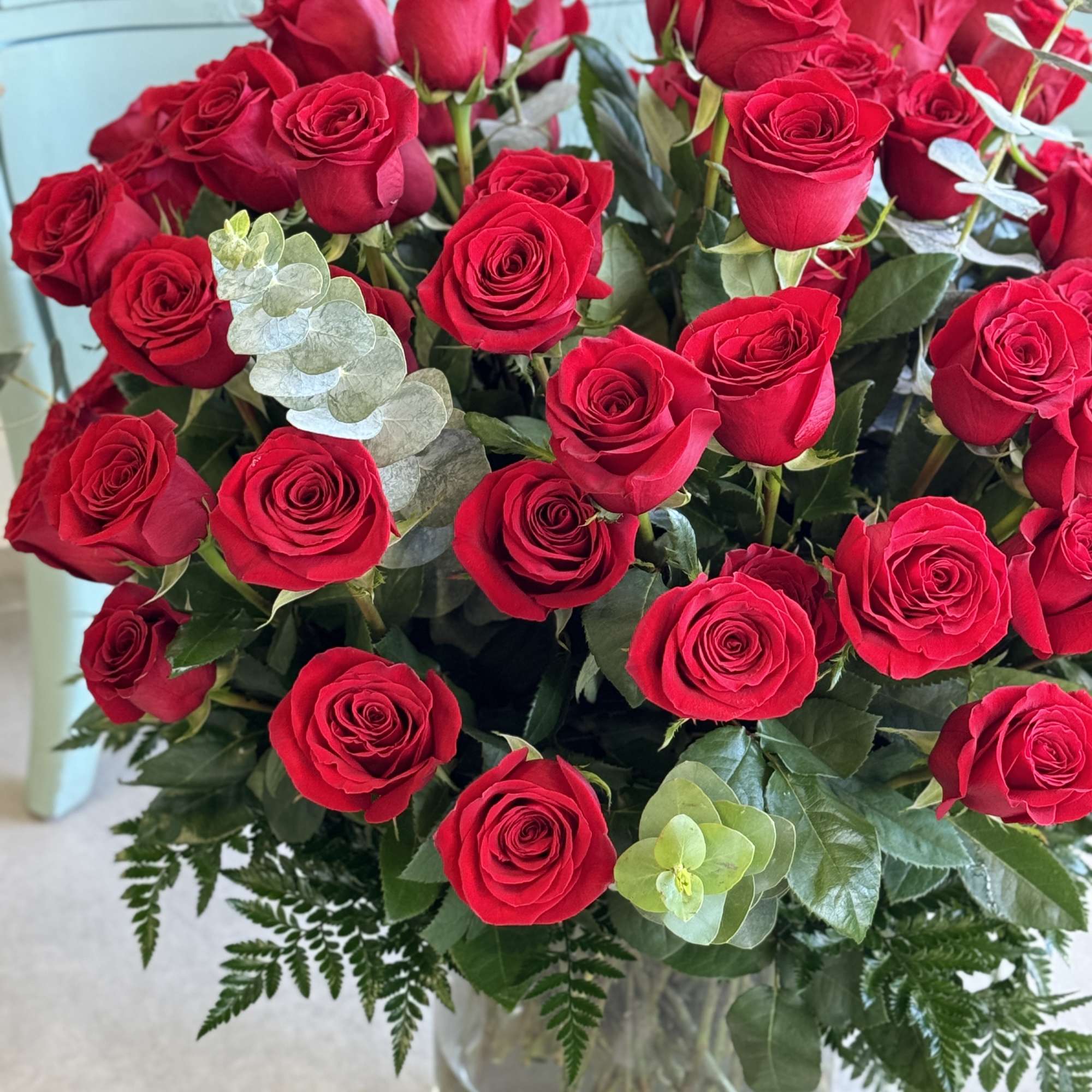 Bouquet of red roses in a clear glass vase