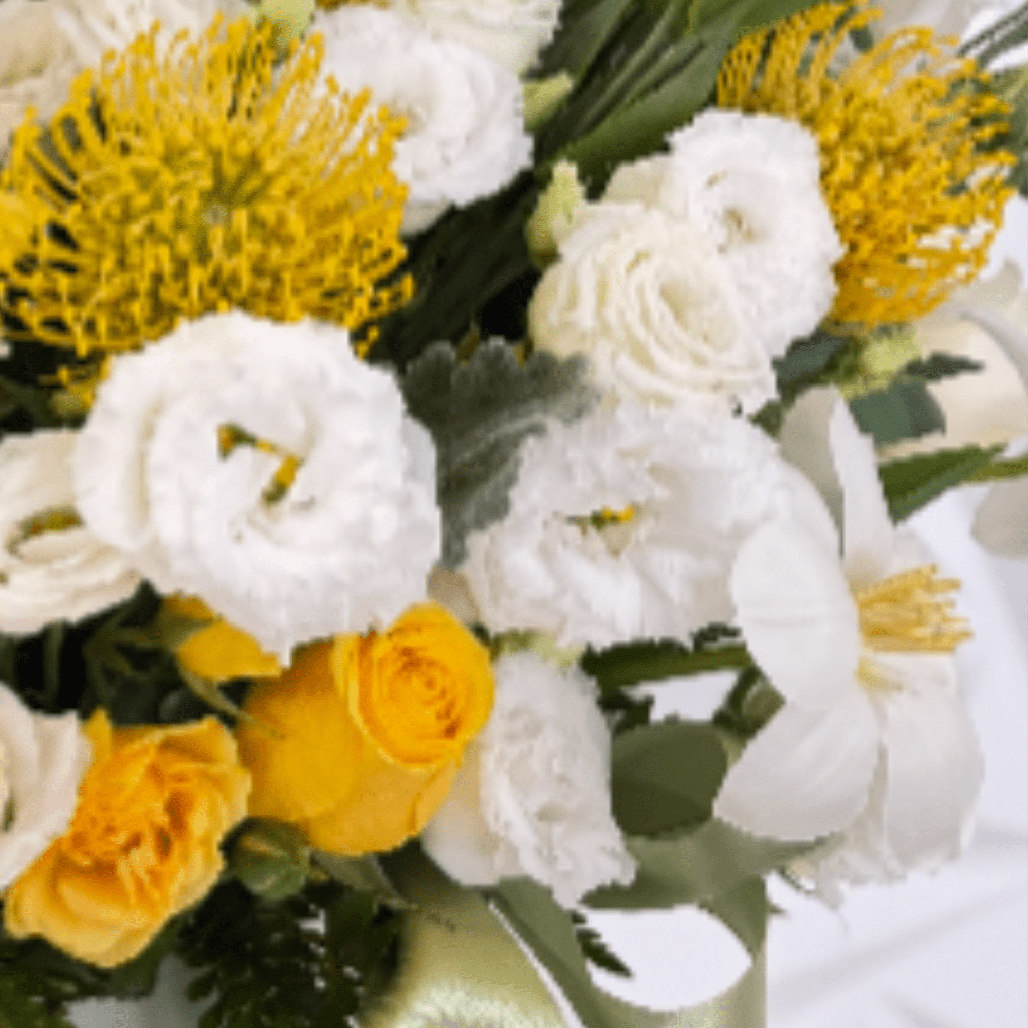 This sophisticated floral arrangement is beautifully designed in an elegant ceramic vase