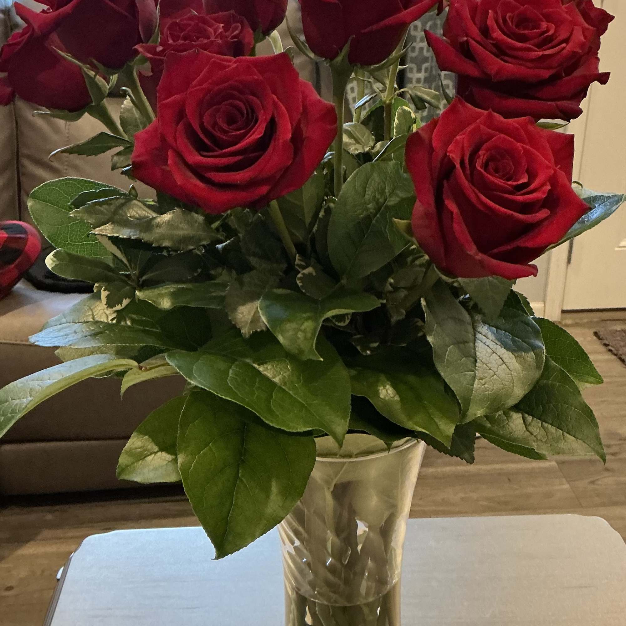 Bouquet of red roses in a clear glass vase