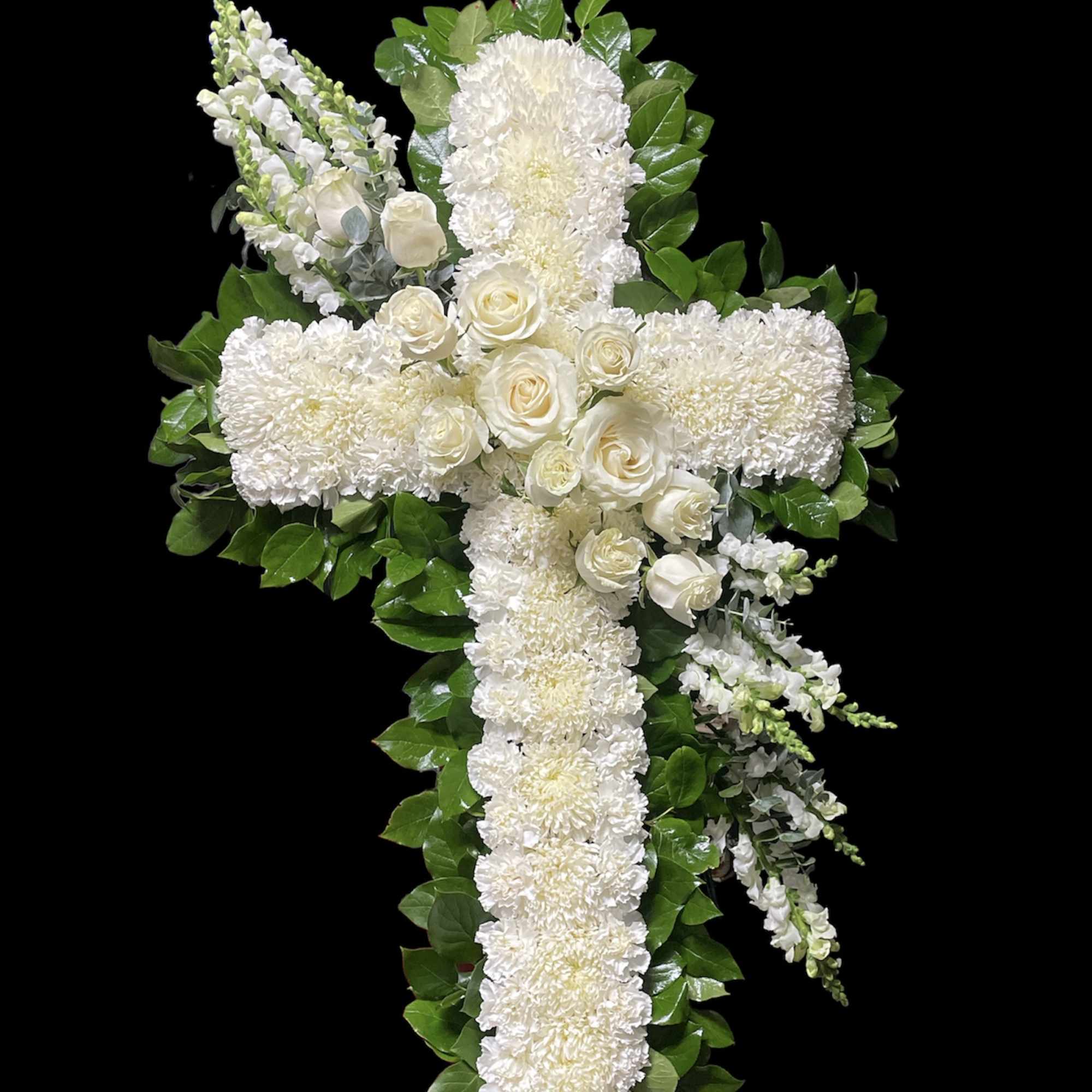 White floral cross arrangement with roses and chrysanthemums