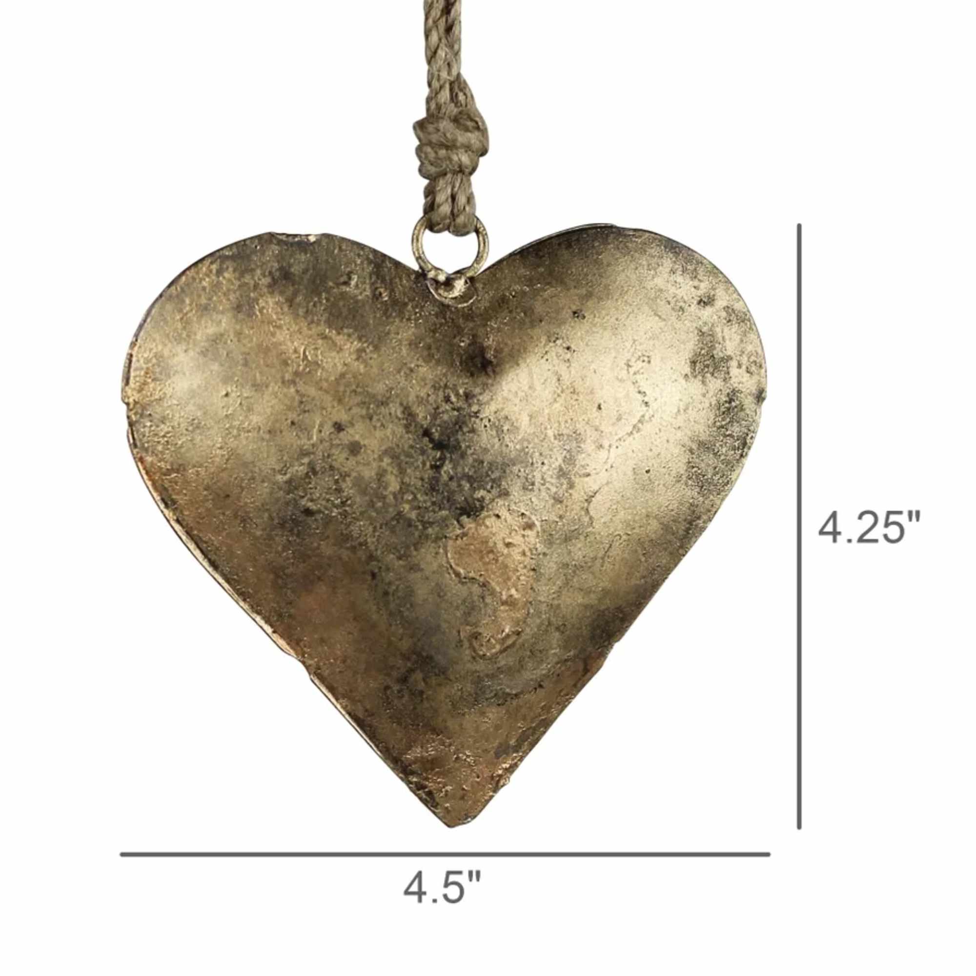 Metal heart ornament hanging from a rope cord