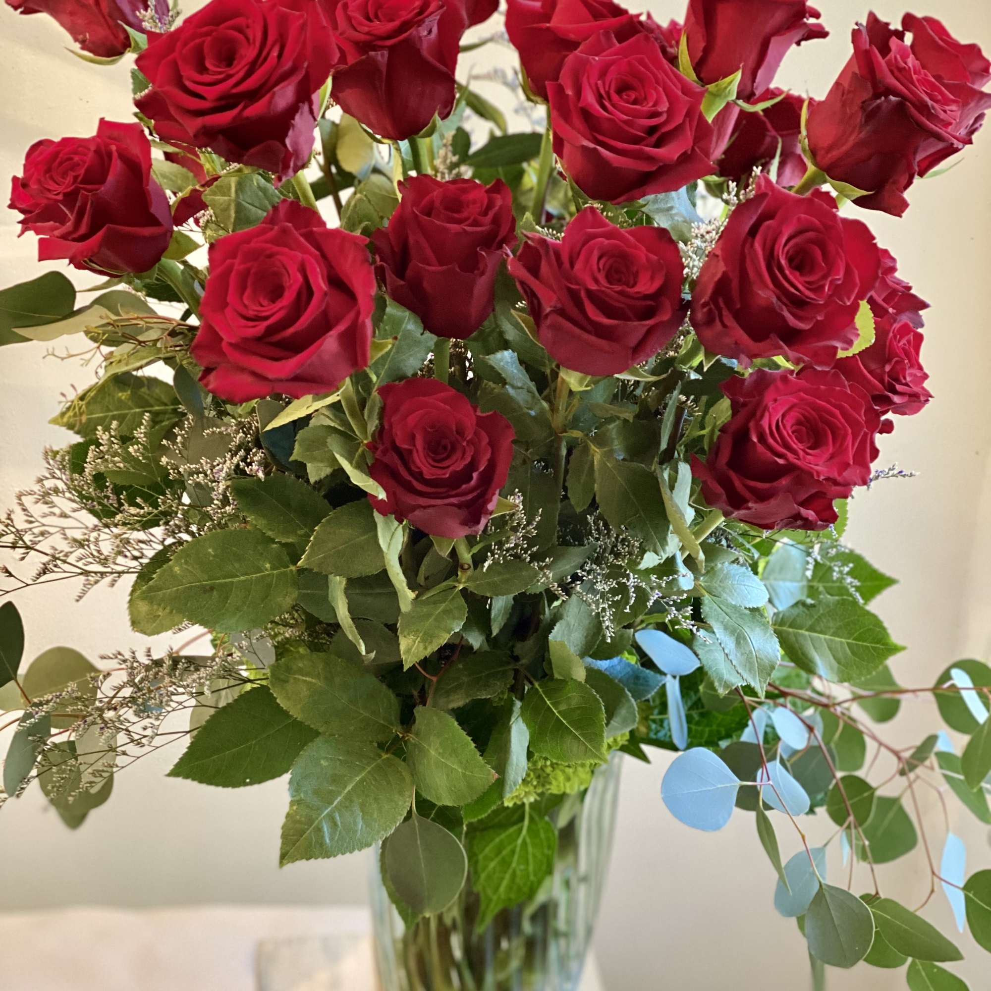 Bouquet of red roses in a clear glass vase
