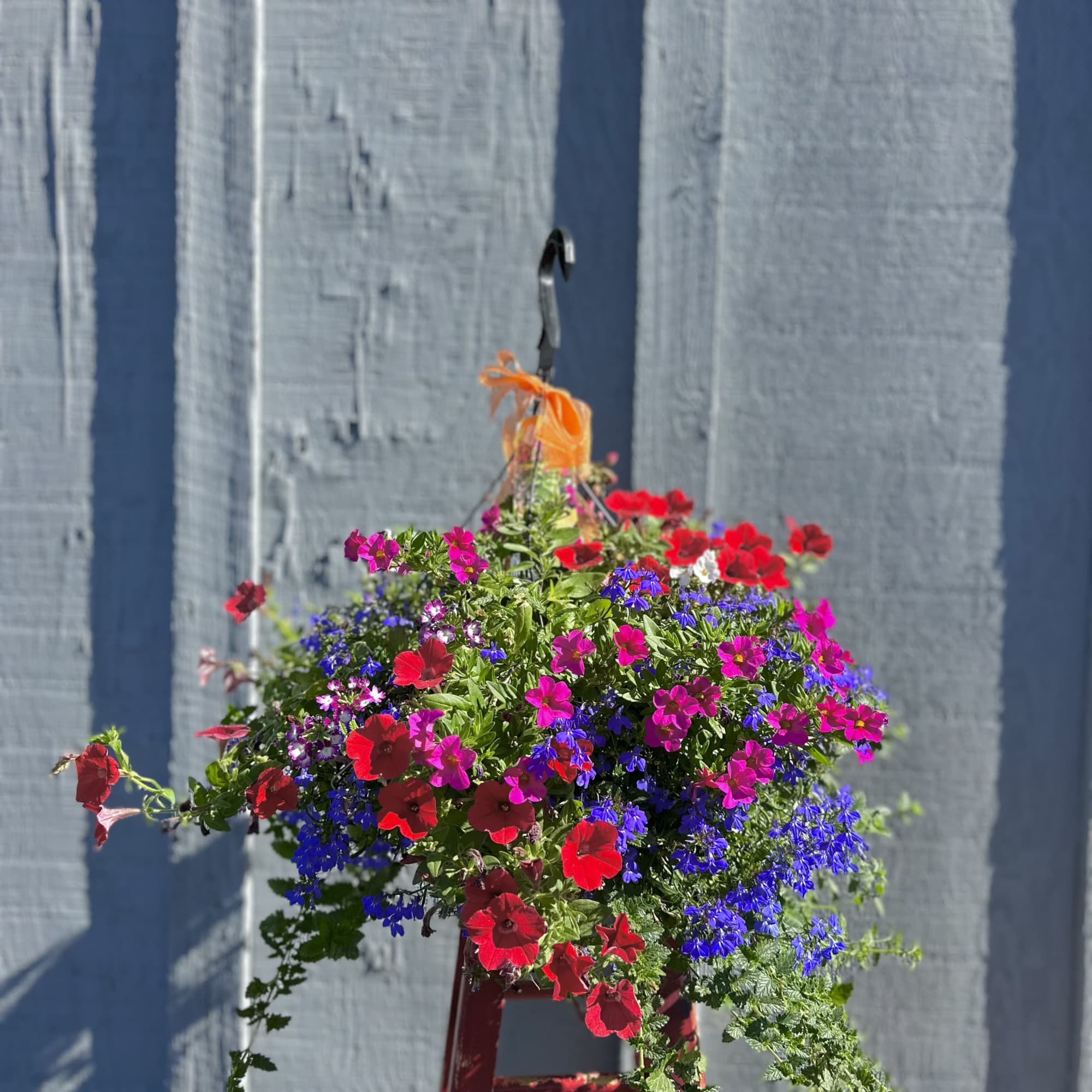 A beautiful, weather durable outdoor floral basket.
