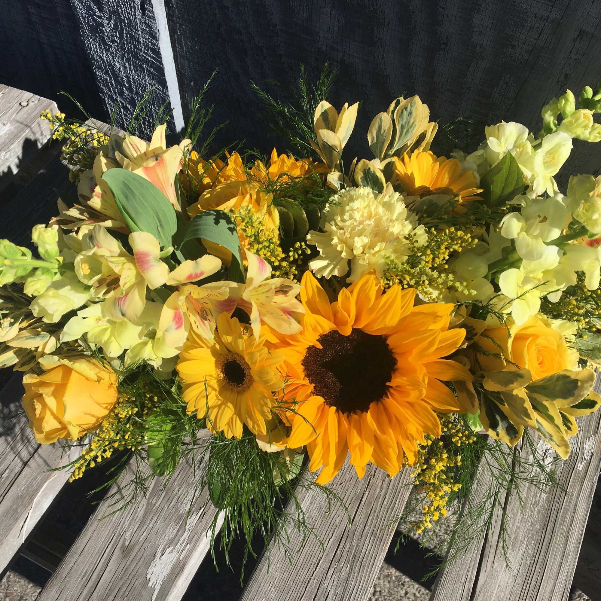 A bright and full beautiful array of yellow and orange flowers in