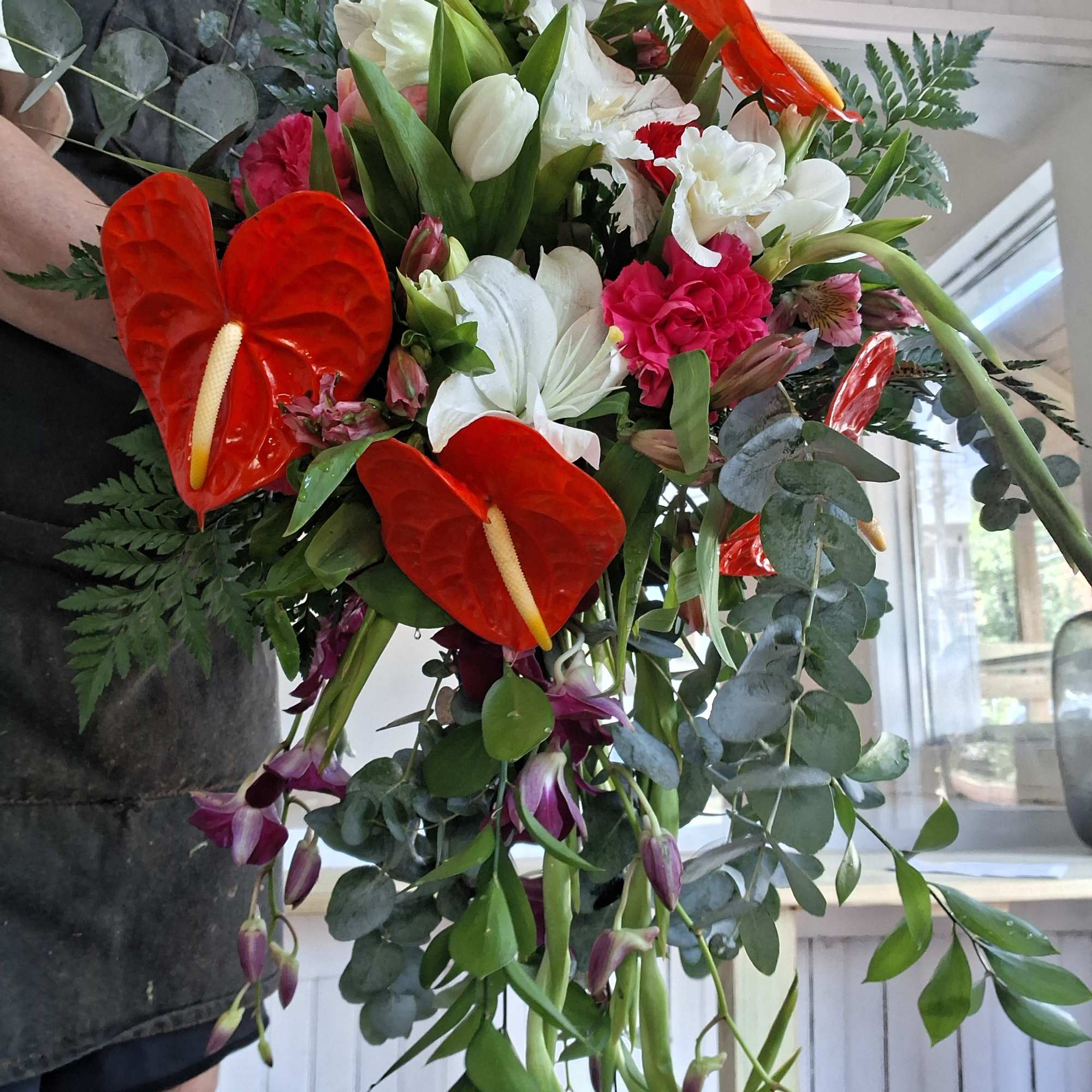 A vibrant, custom‑designed bridal bouquet inspired by the bride&rsquo;s Ecuadorian heritage and