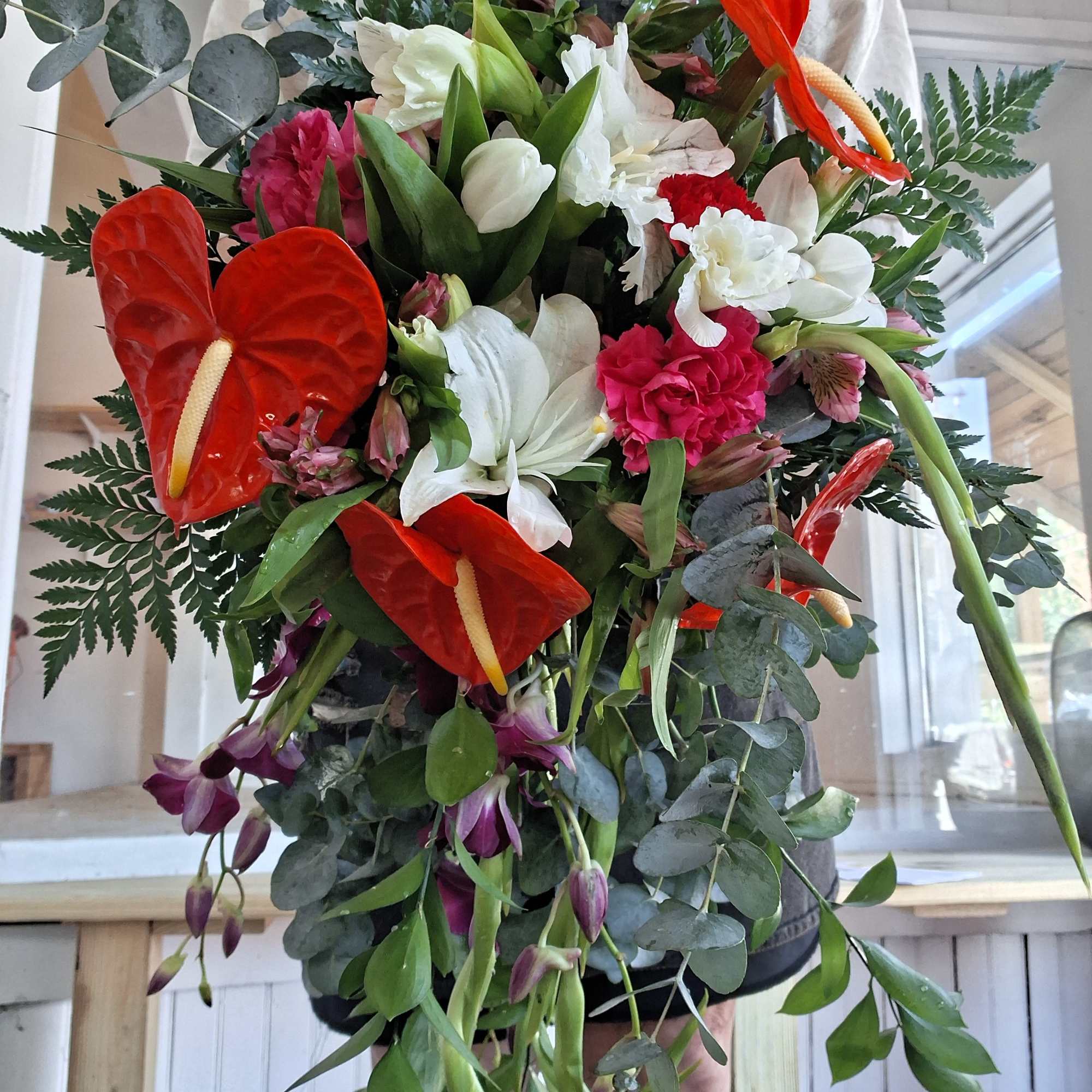 A vibrant, custom‑designed bridal bouquet inspired by the bride&rsquo;s Ecuadorian heritage and