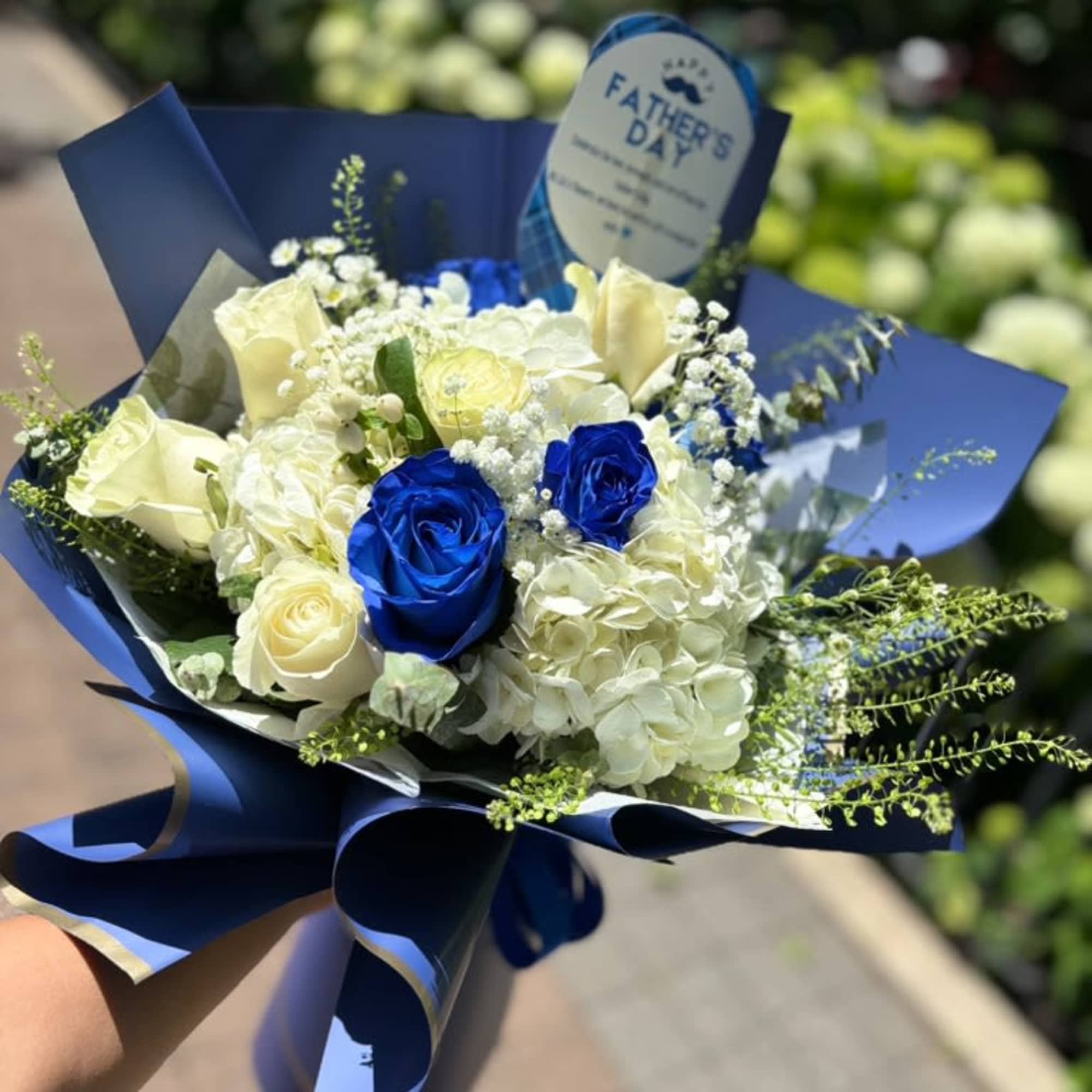 Celebrate Dad with the timeless beauty of the Blue Legacy Bouquet. Featuring